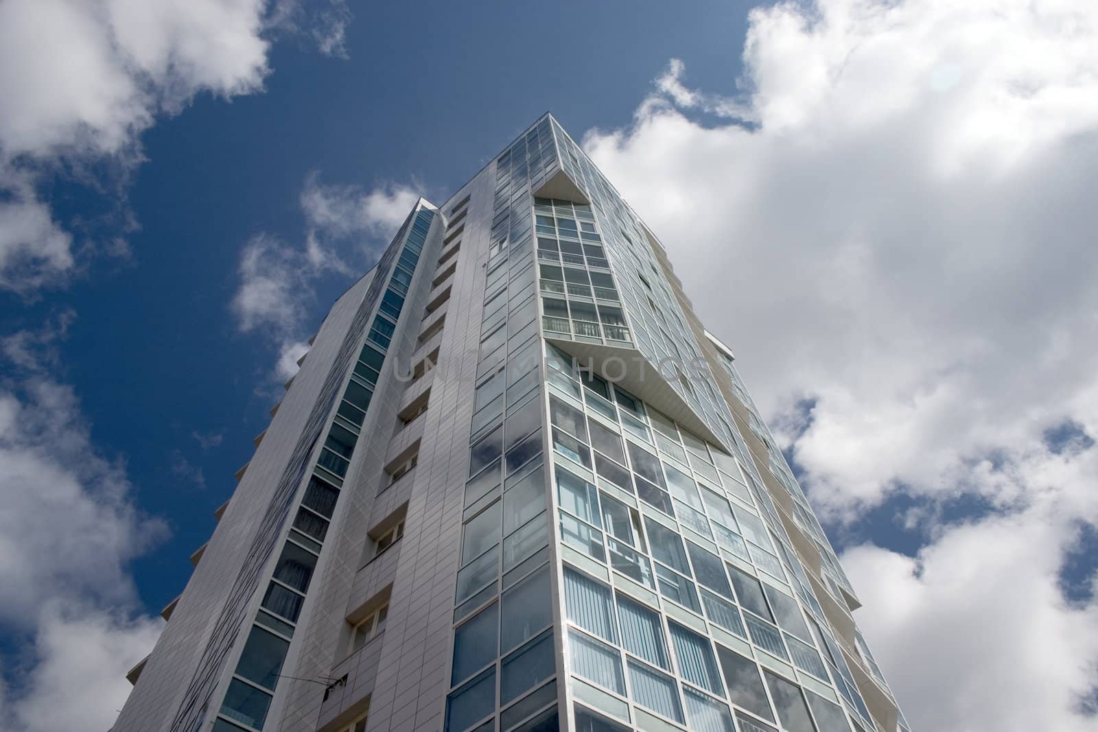 Modern urban building. Glass balconies.