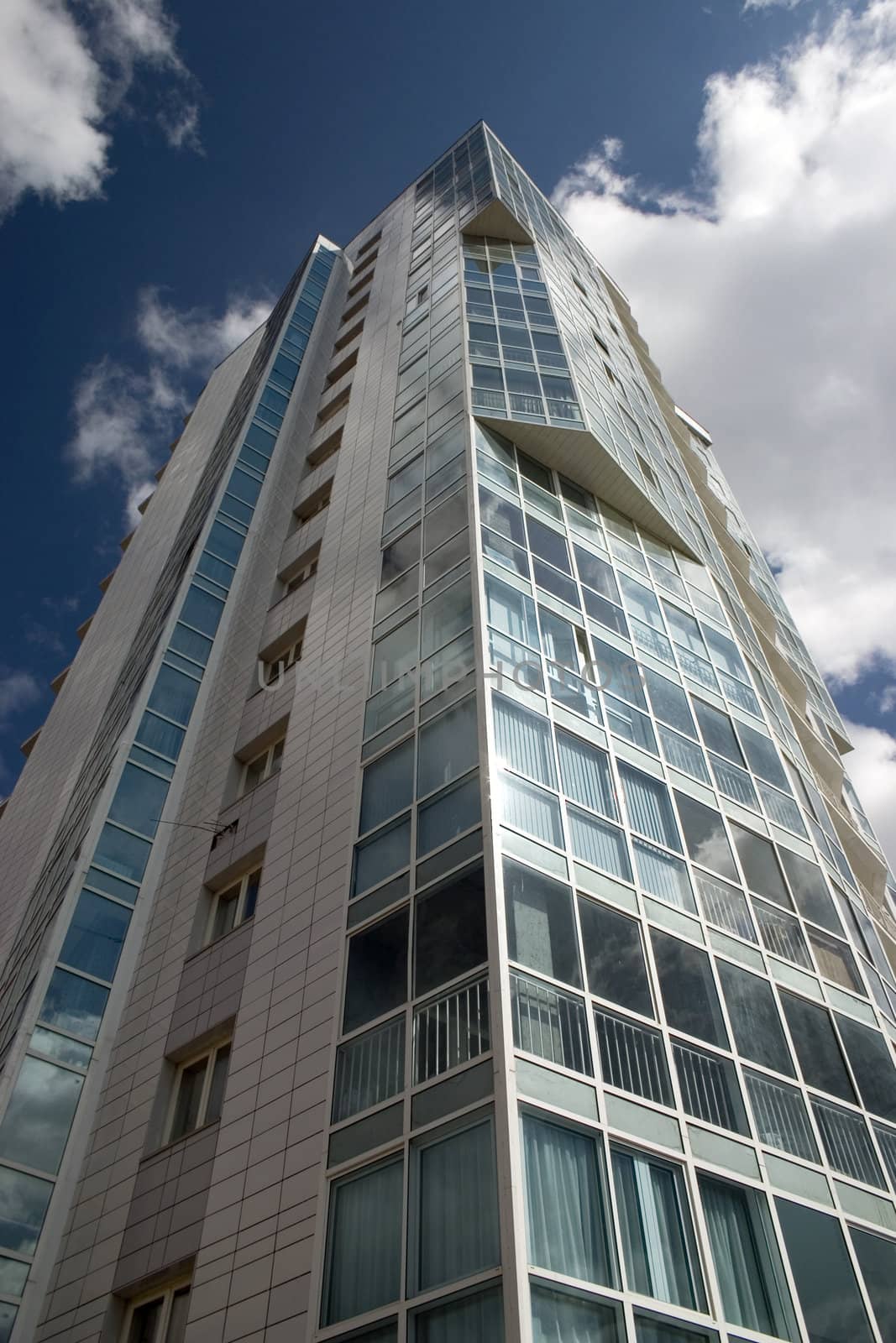 Modern urban building. Glass balconies.