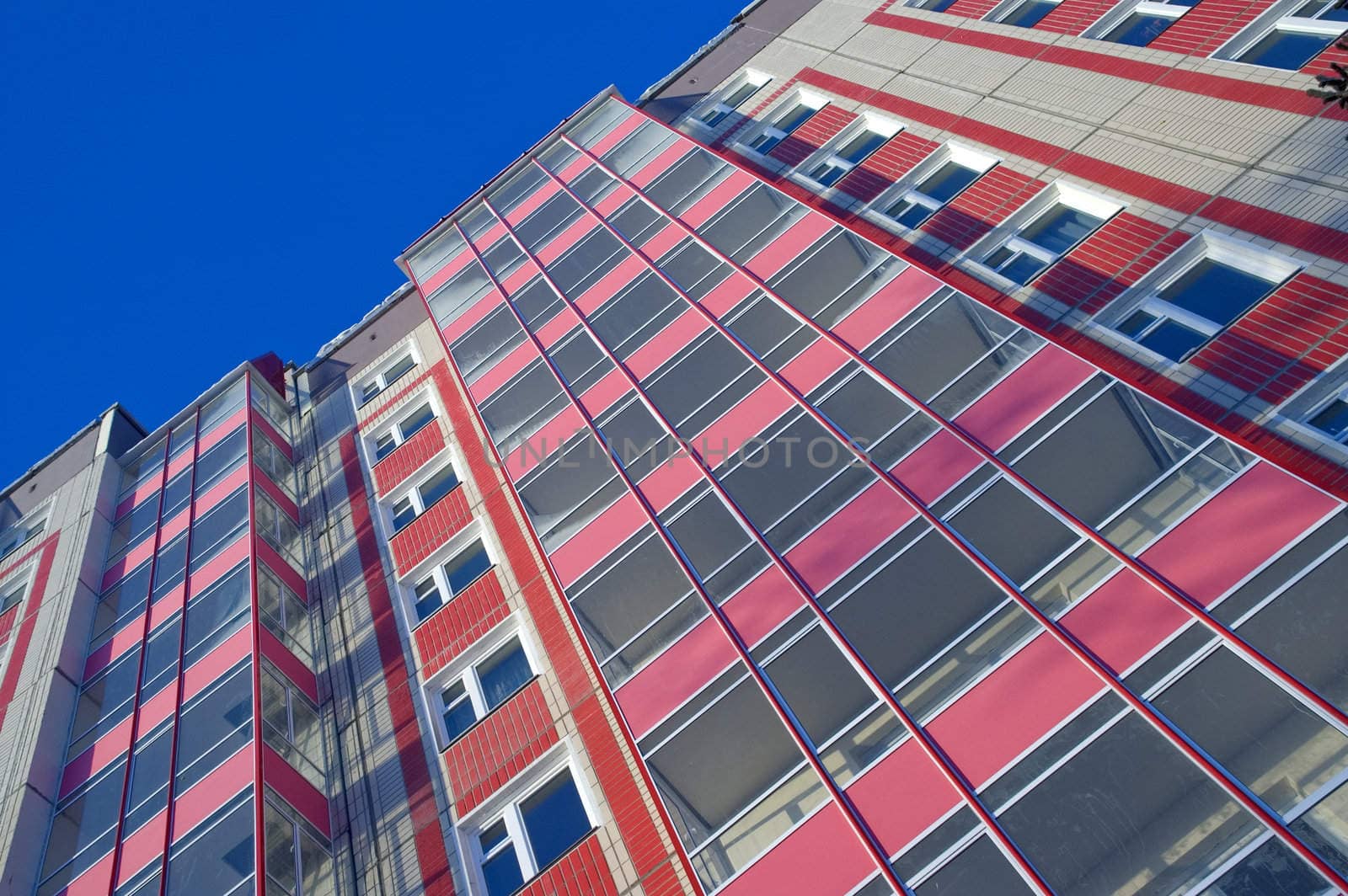 Modern urban building. Glass balconies.