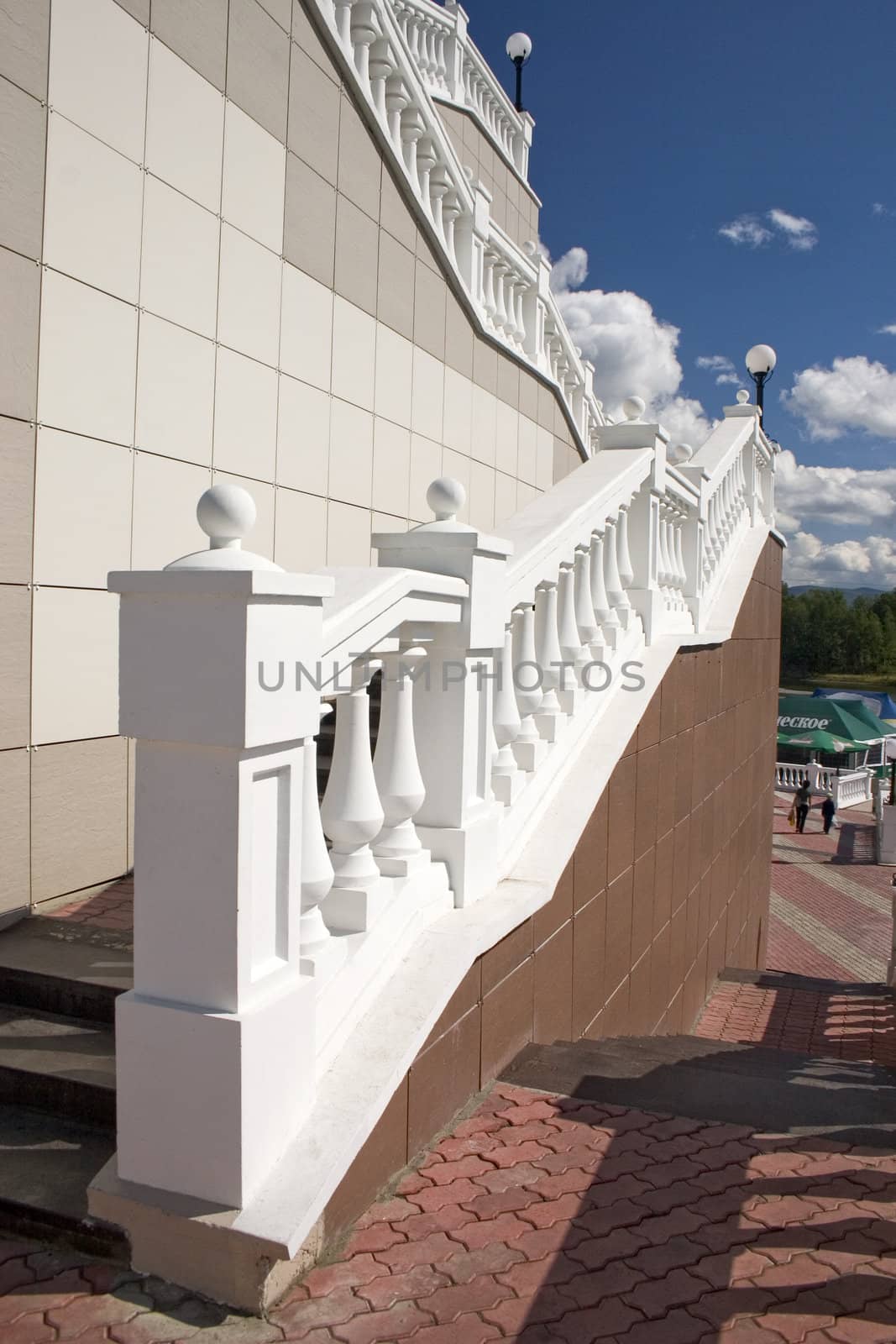 Ladder with a lantern and white balustrade.