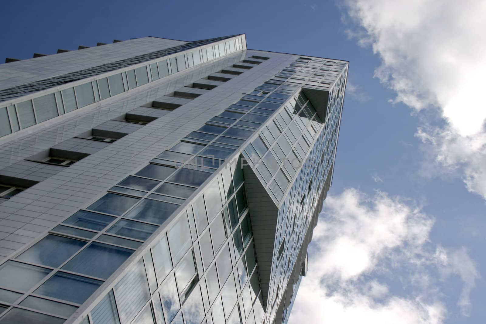 Modern urban building. Glass balconies.