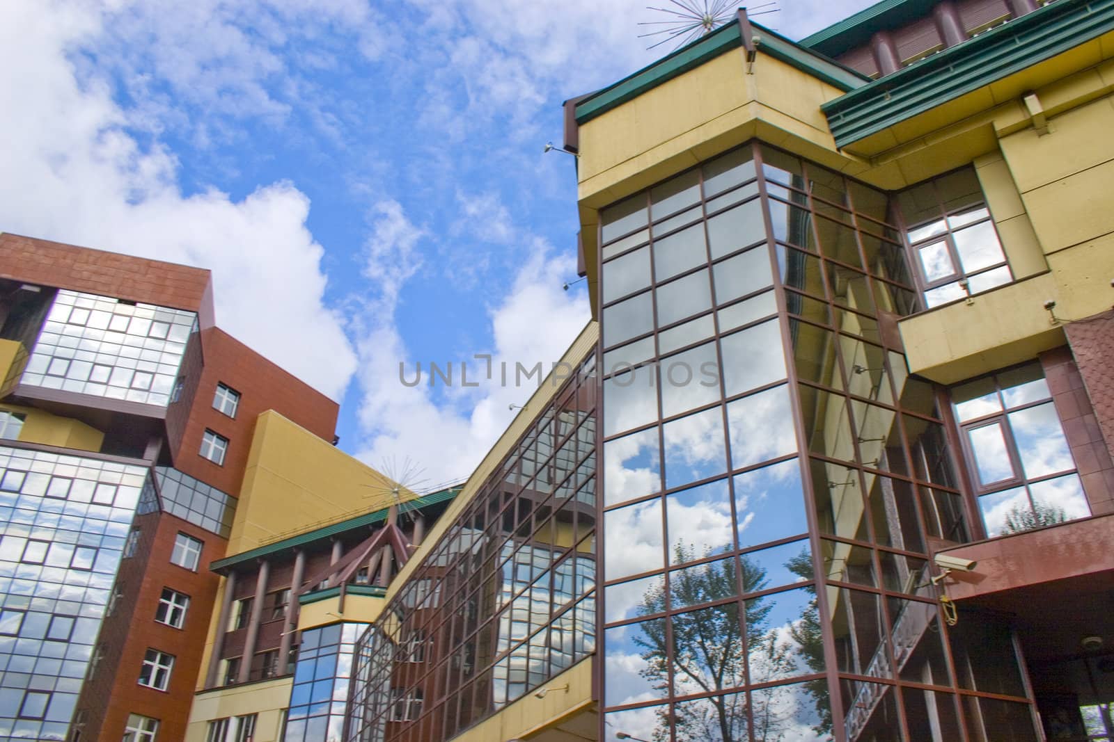 Modern building from a brick. Glass windows and balconies.