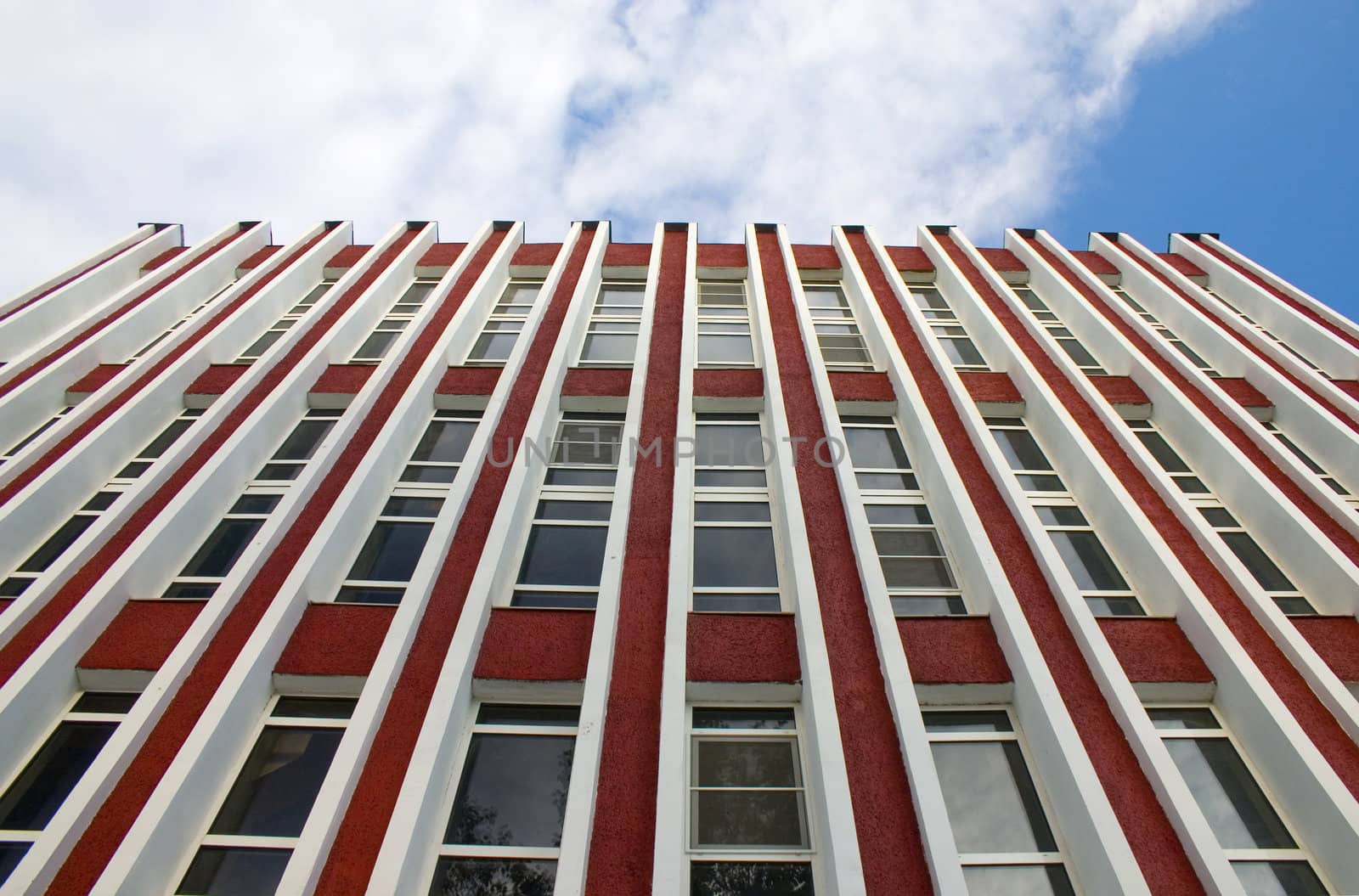 Modern building from a brick. Glass windows.