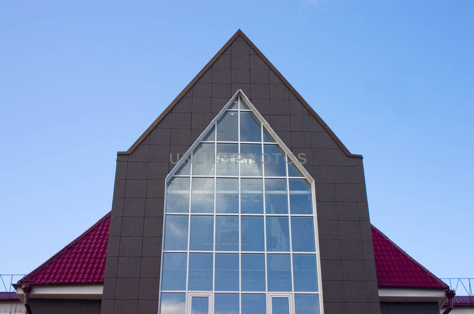 Modern building from a brick. Glass windows.
