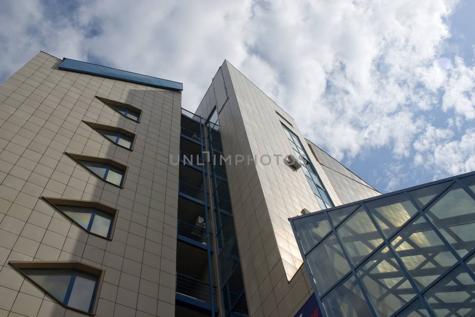 Modern urban building. Glass balconies.