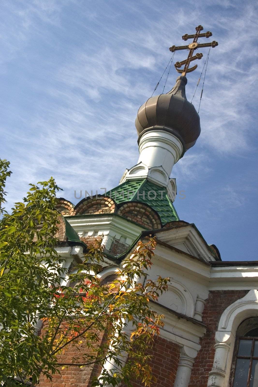  On a background of the light-blue sky church with domes.