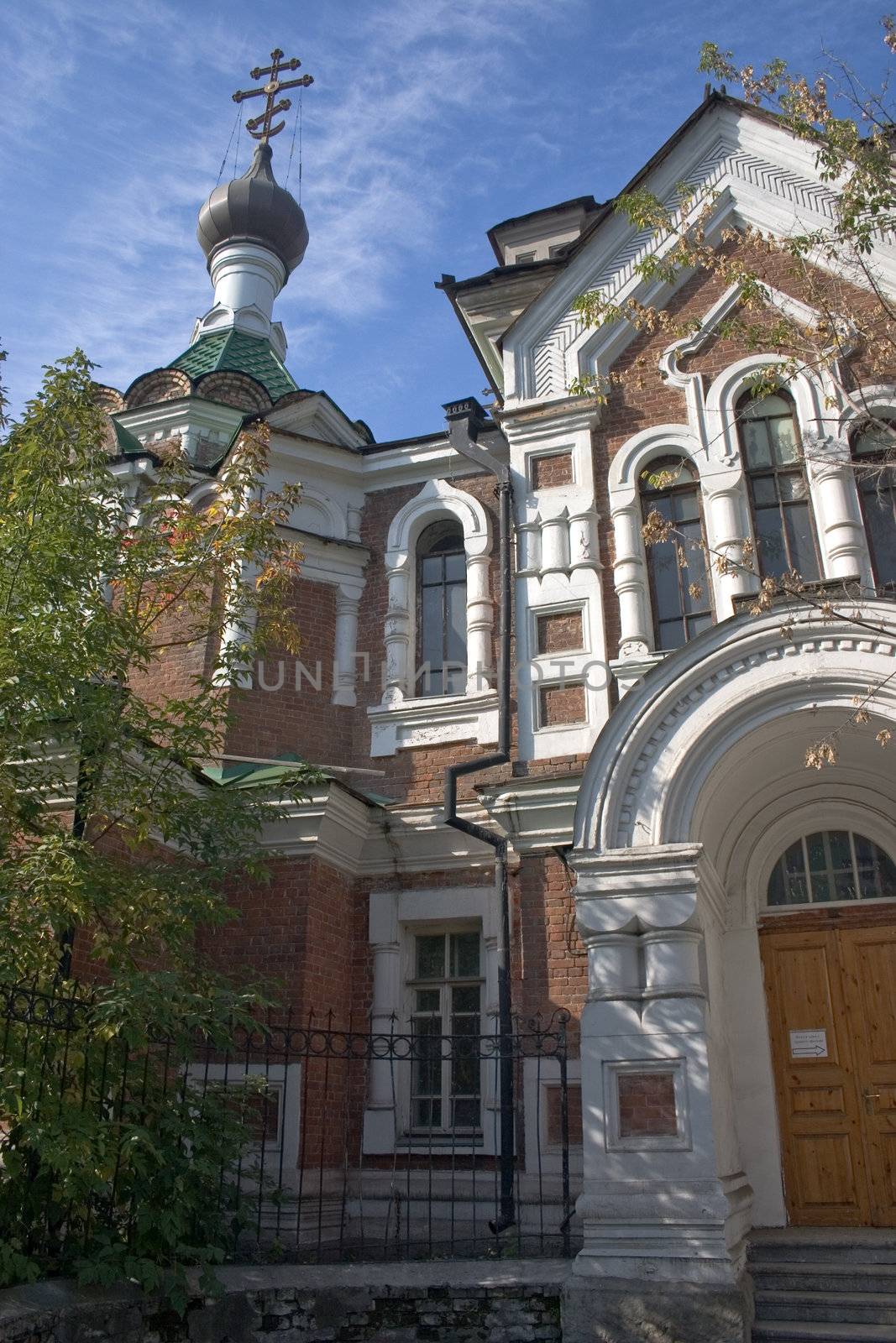 On a background of the light-blue sky church with domes.