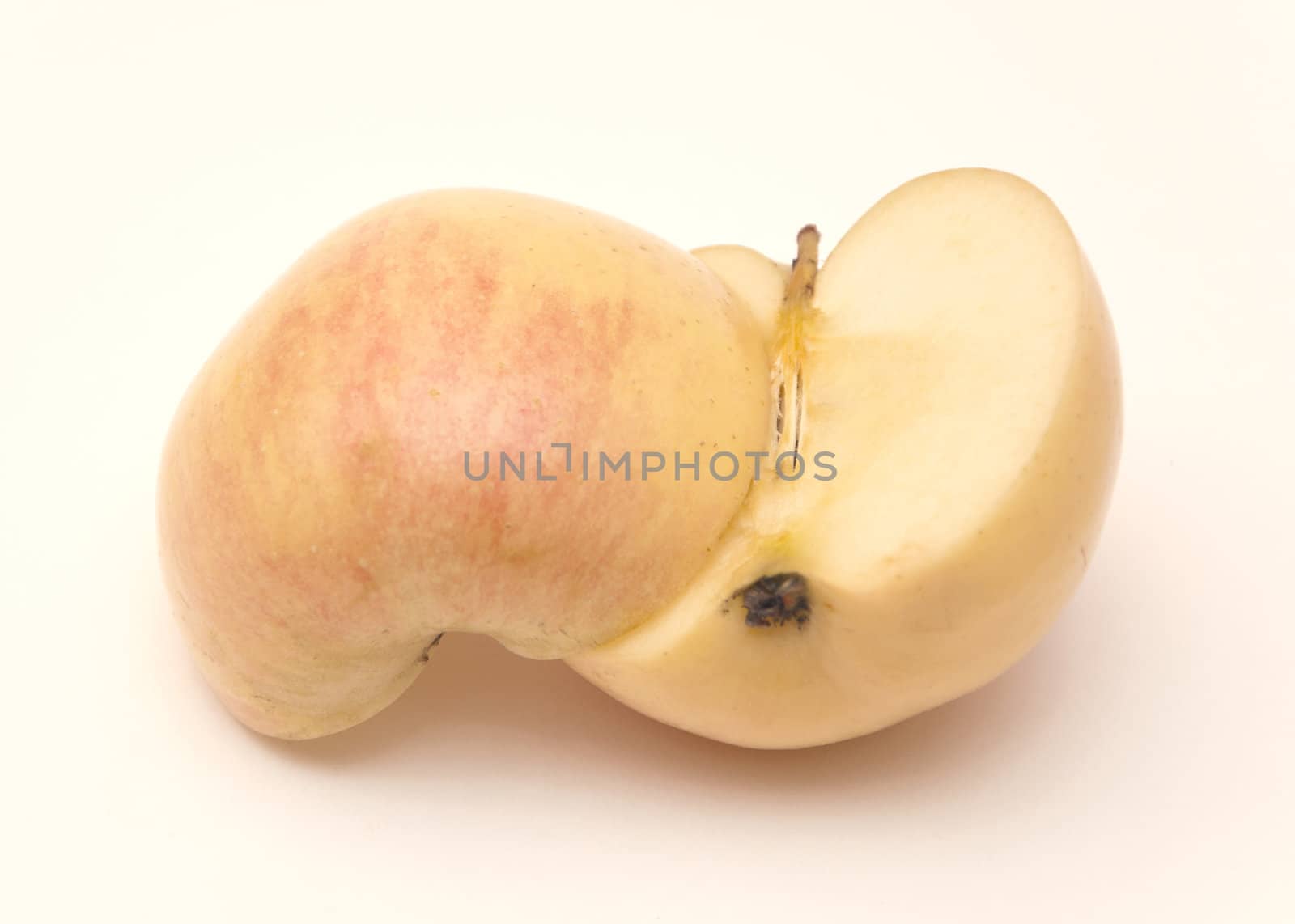Two halves of juicy ripe apple on white background
