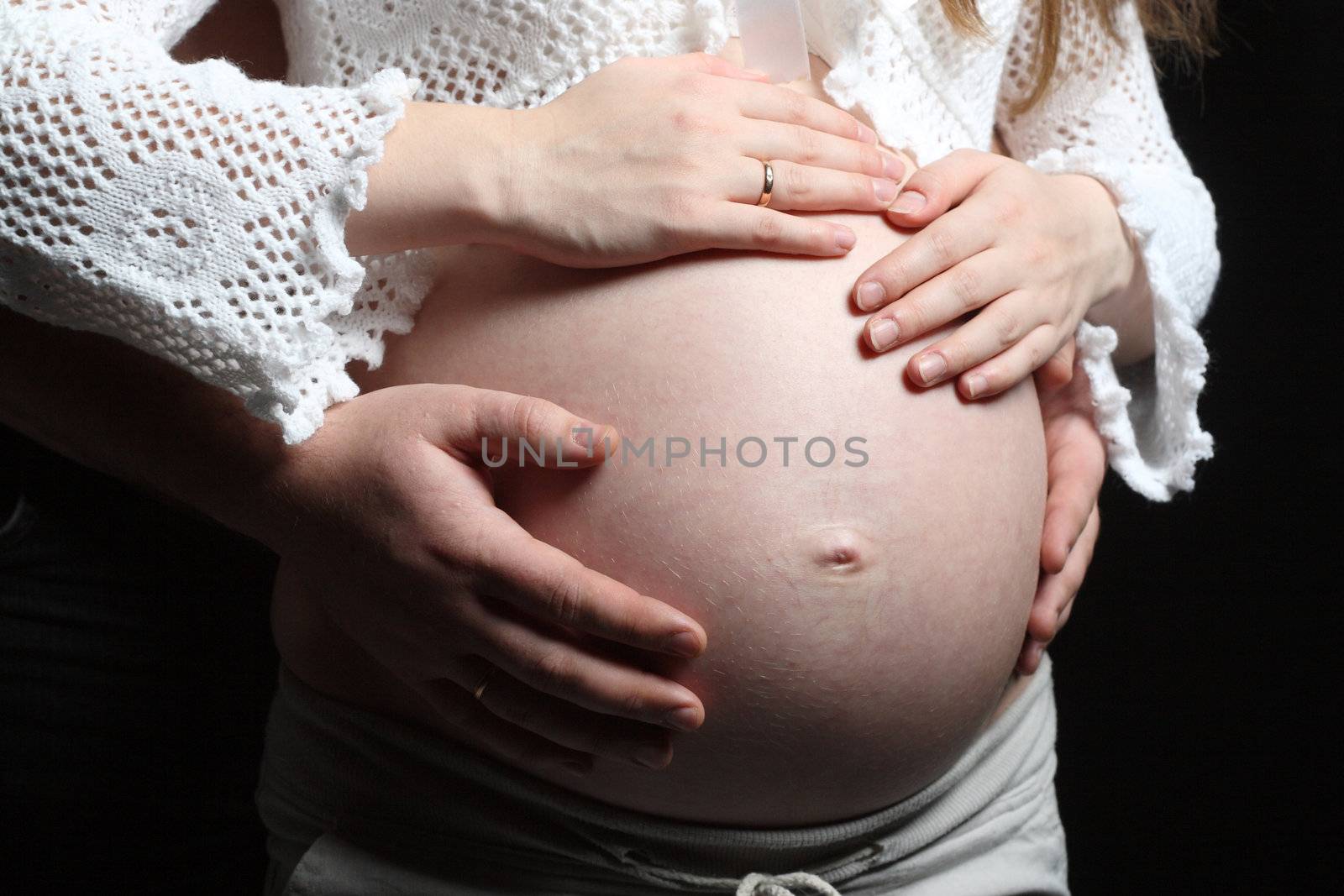 Big belly of a 32 weeks pregnant woman