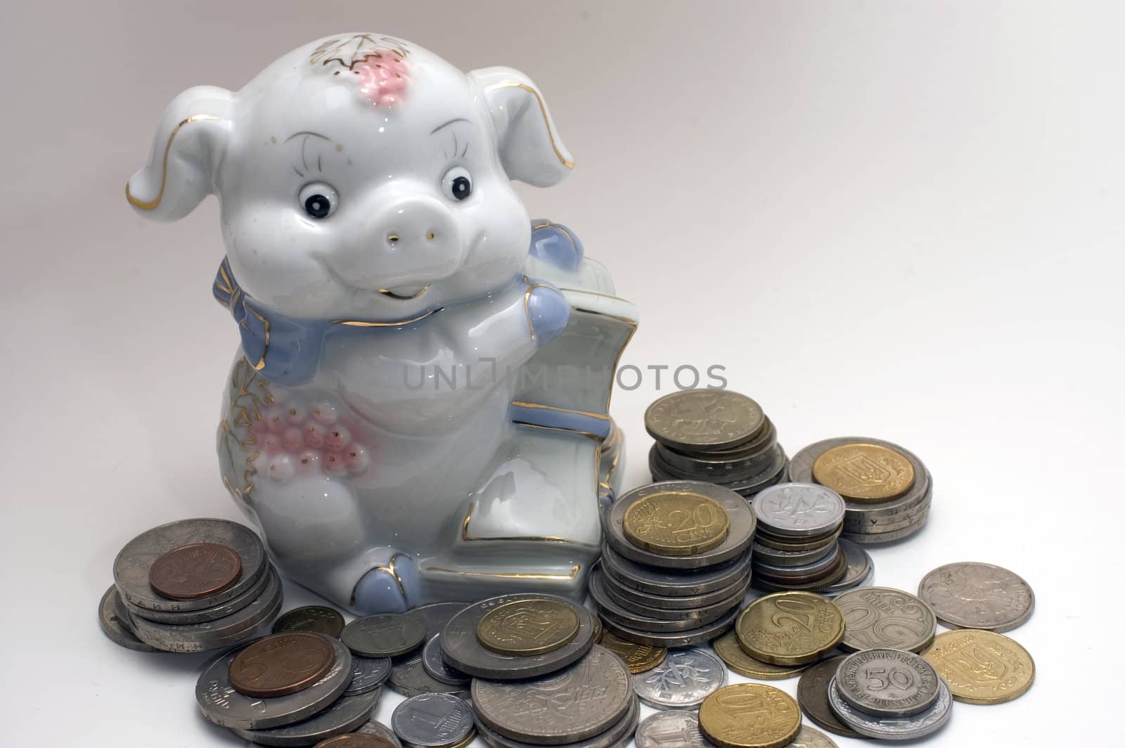 Piggy bank swine. Coin pile isolated on white background.