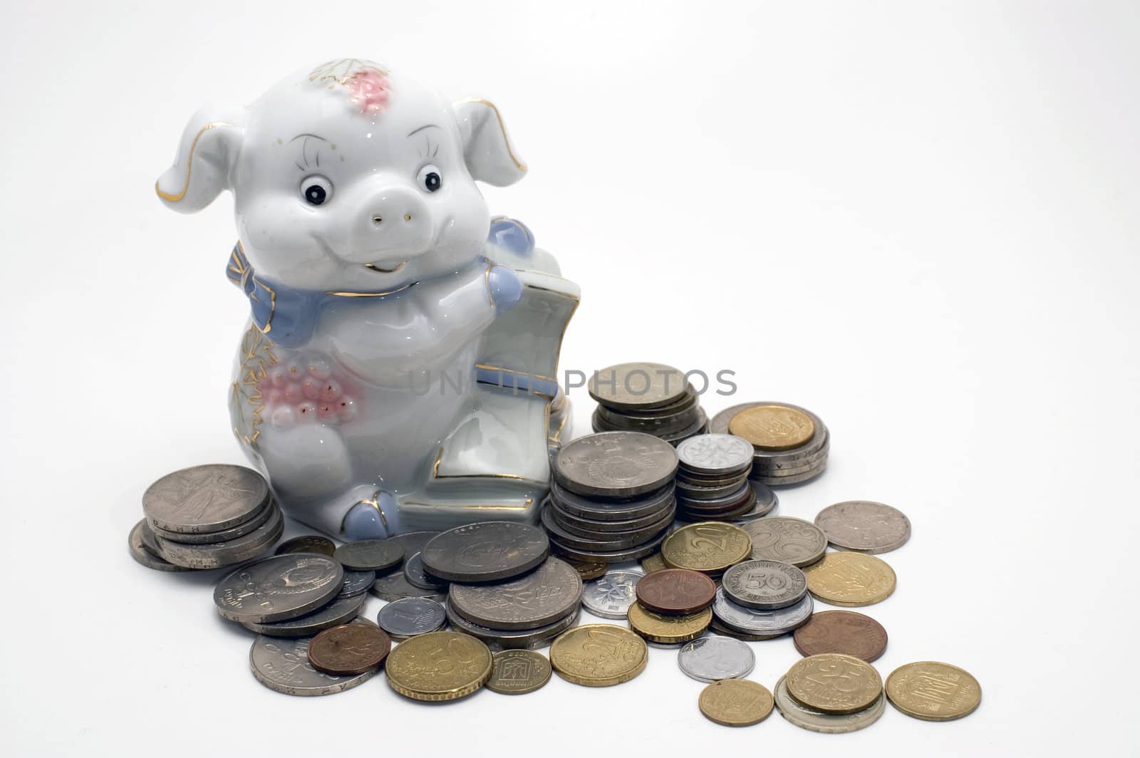 Piggy bank swine. Coin pile isolated on white background.