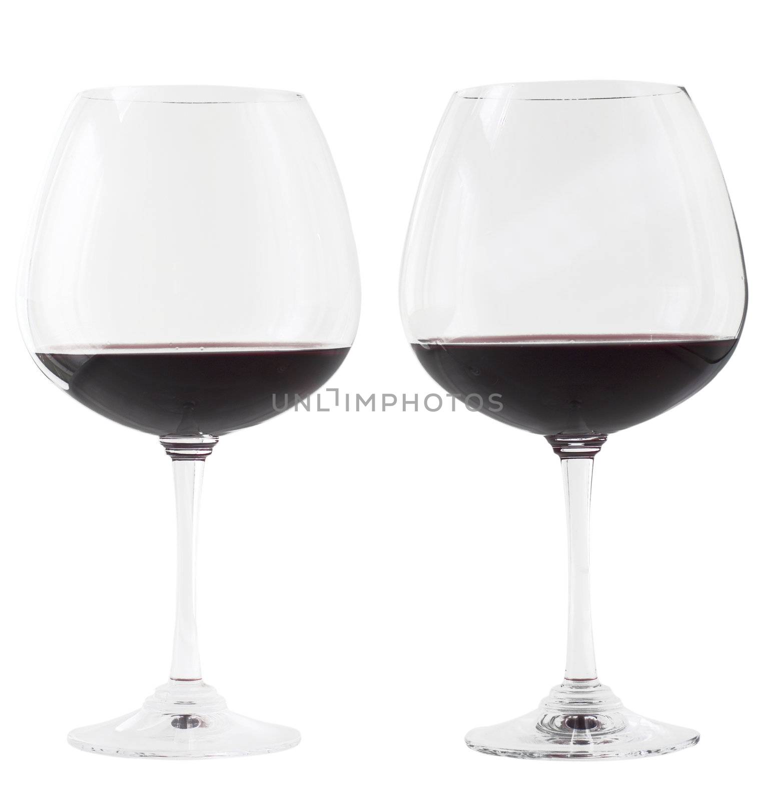 Two glasses of red wine over white background