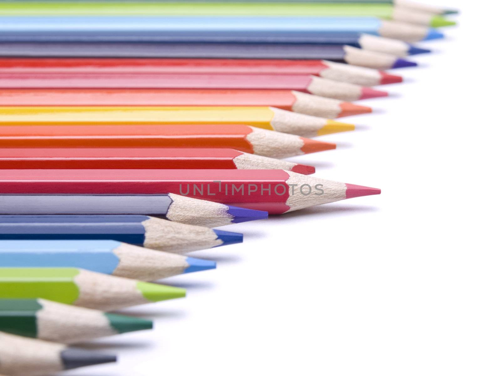 A red pencil comes out from the row of color pencils.