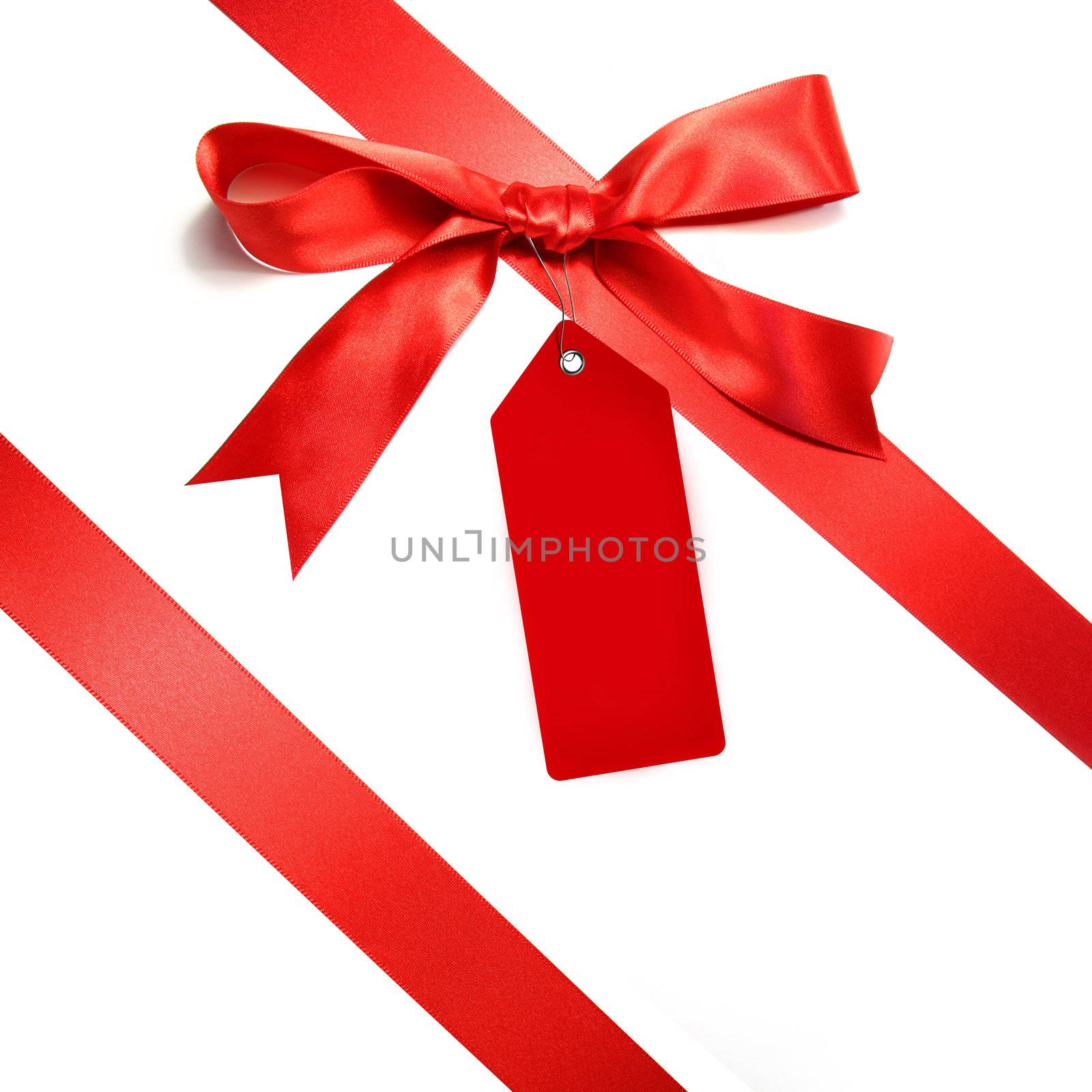 Holiday red bow islotaed on white background by Sandralise