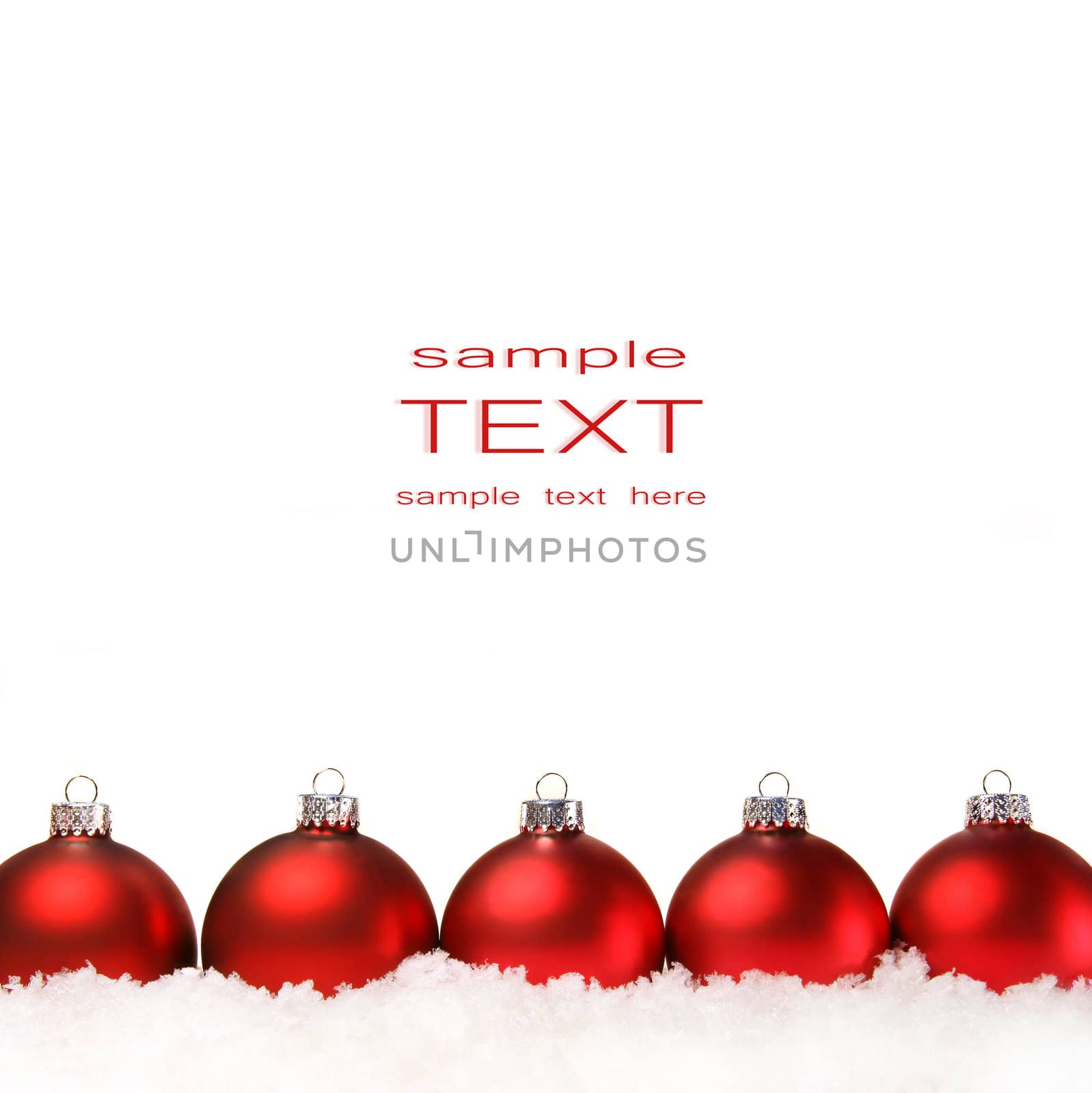 Red christmas balls with snow isolated on white  by Sandralise