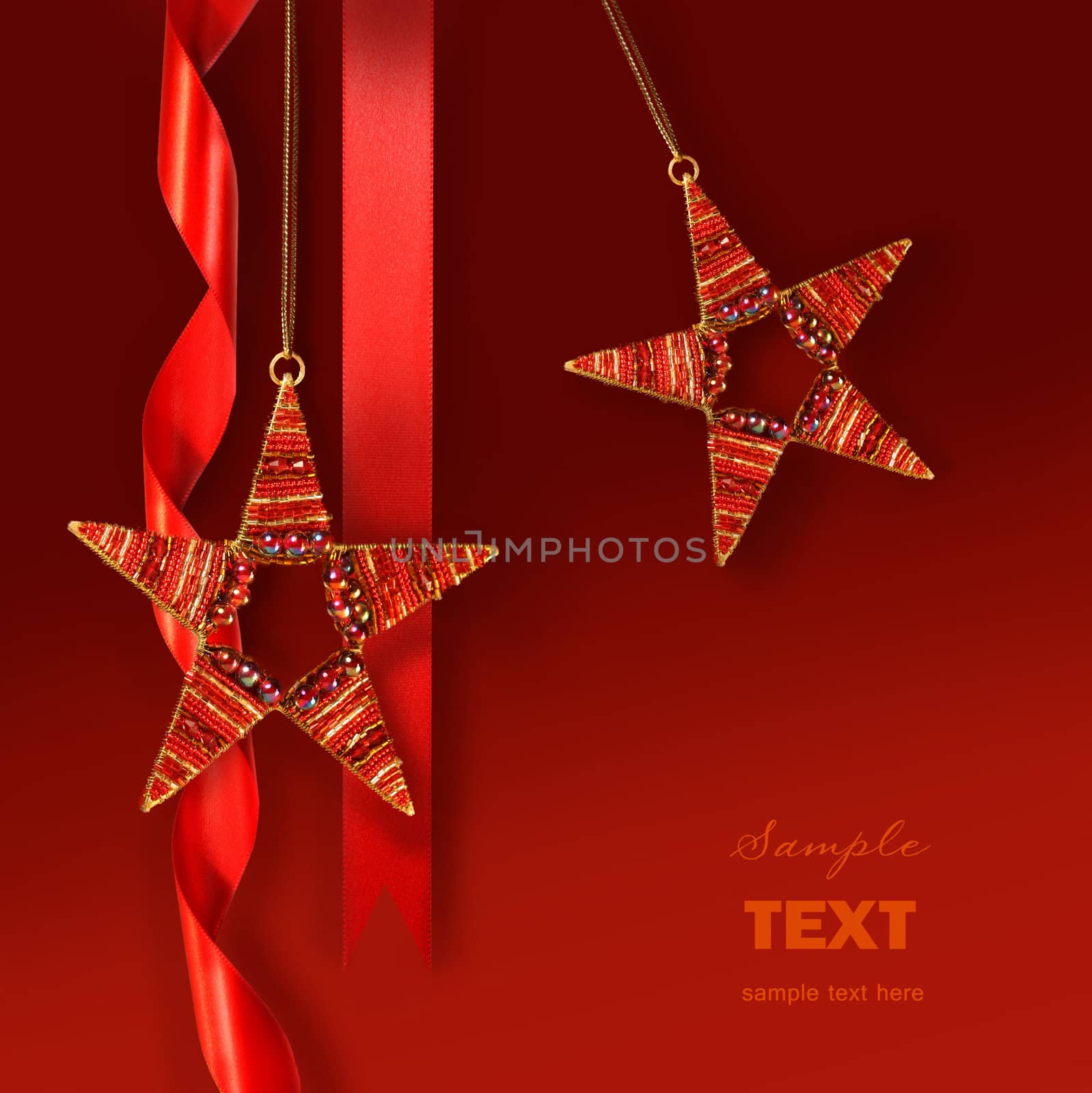 Christmas star ornaments against red background by Sandralise