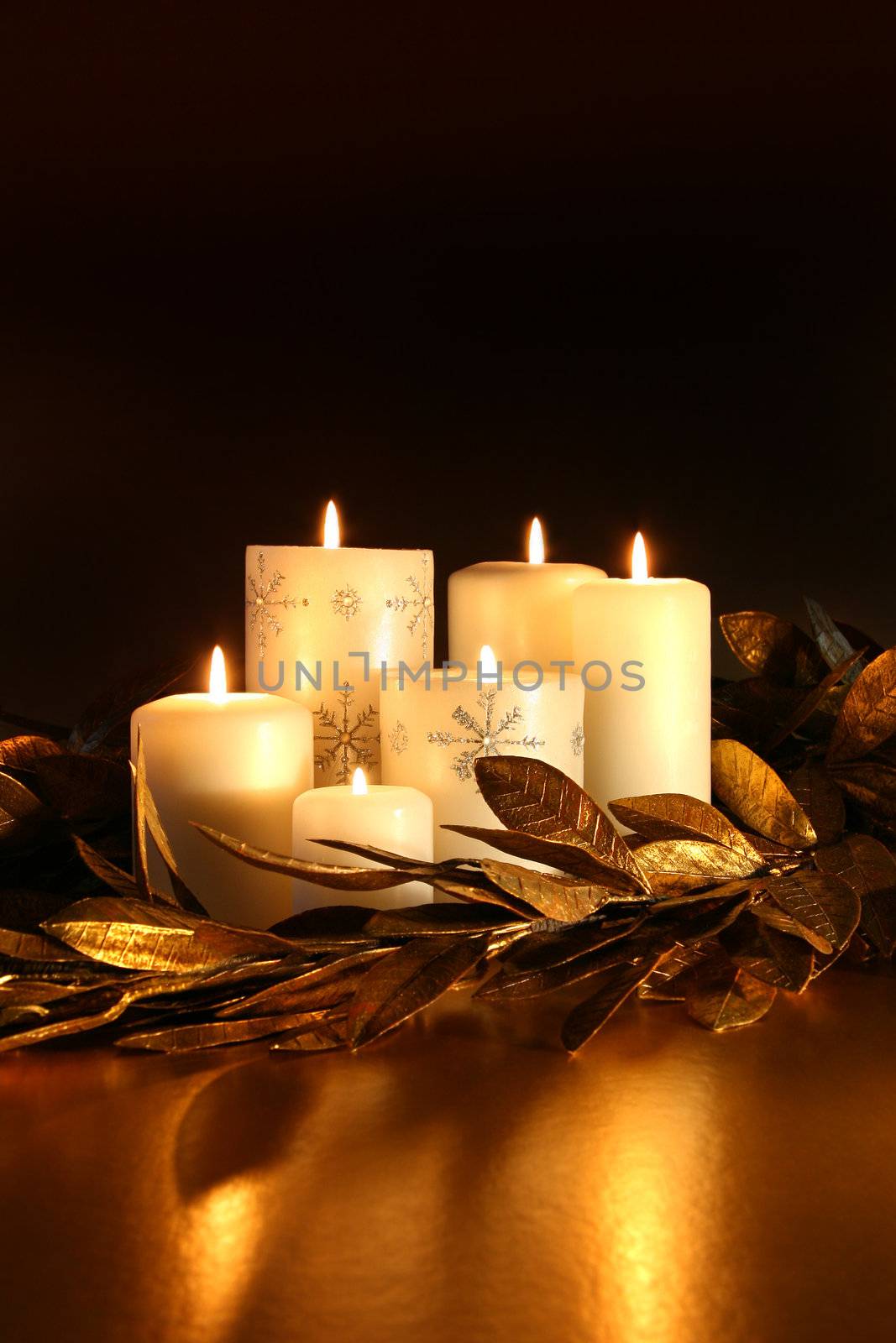 White candles with gold leaf garland  by Sandralise