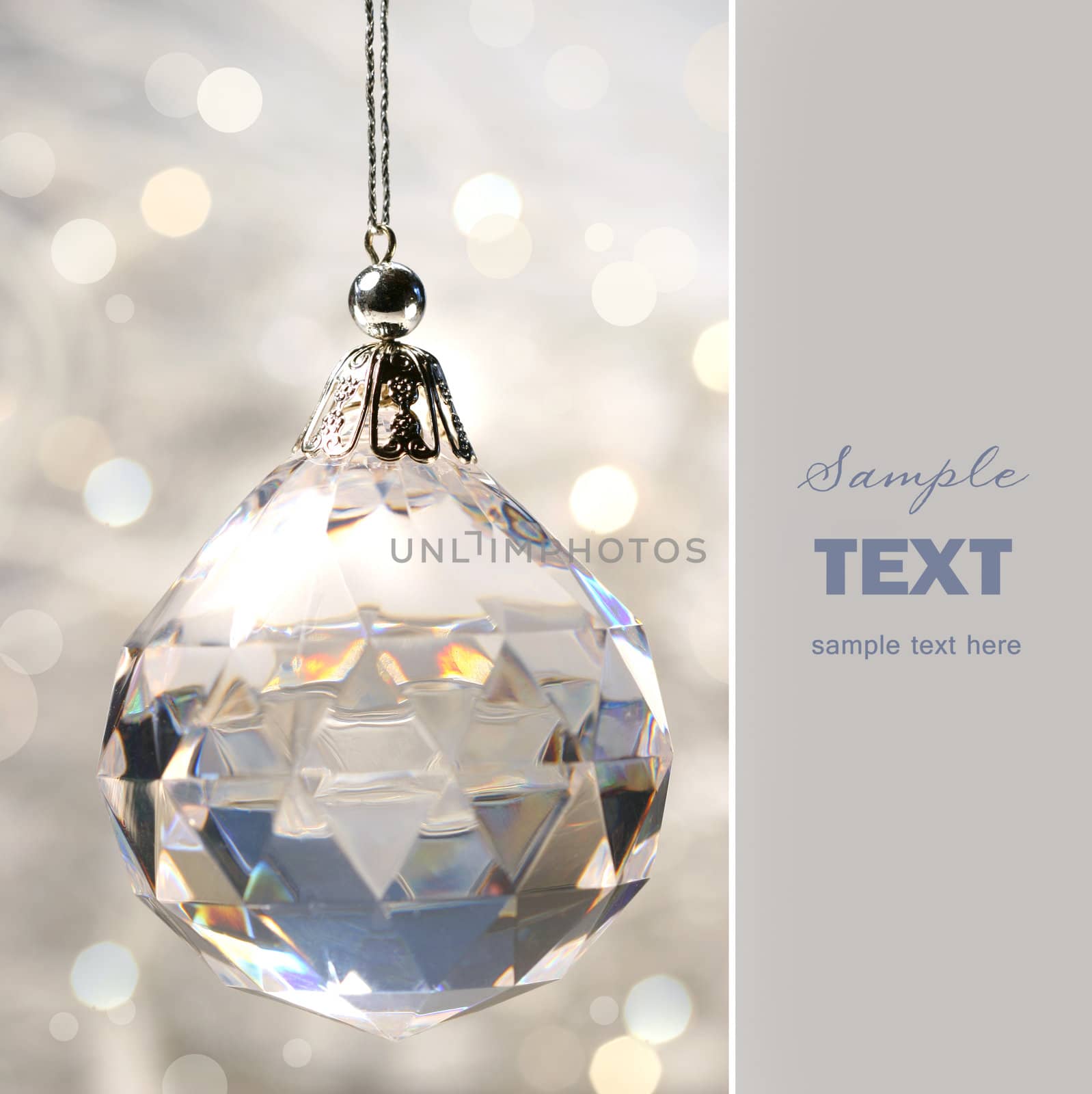 Crystal ornament hanging against shimmering background