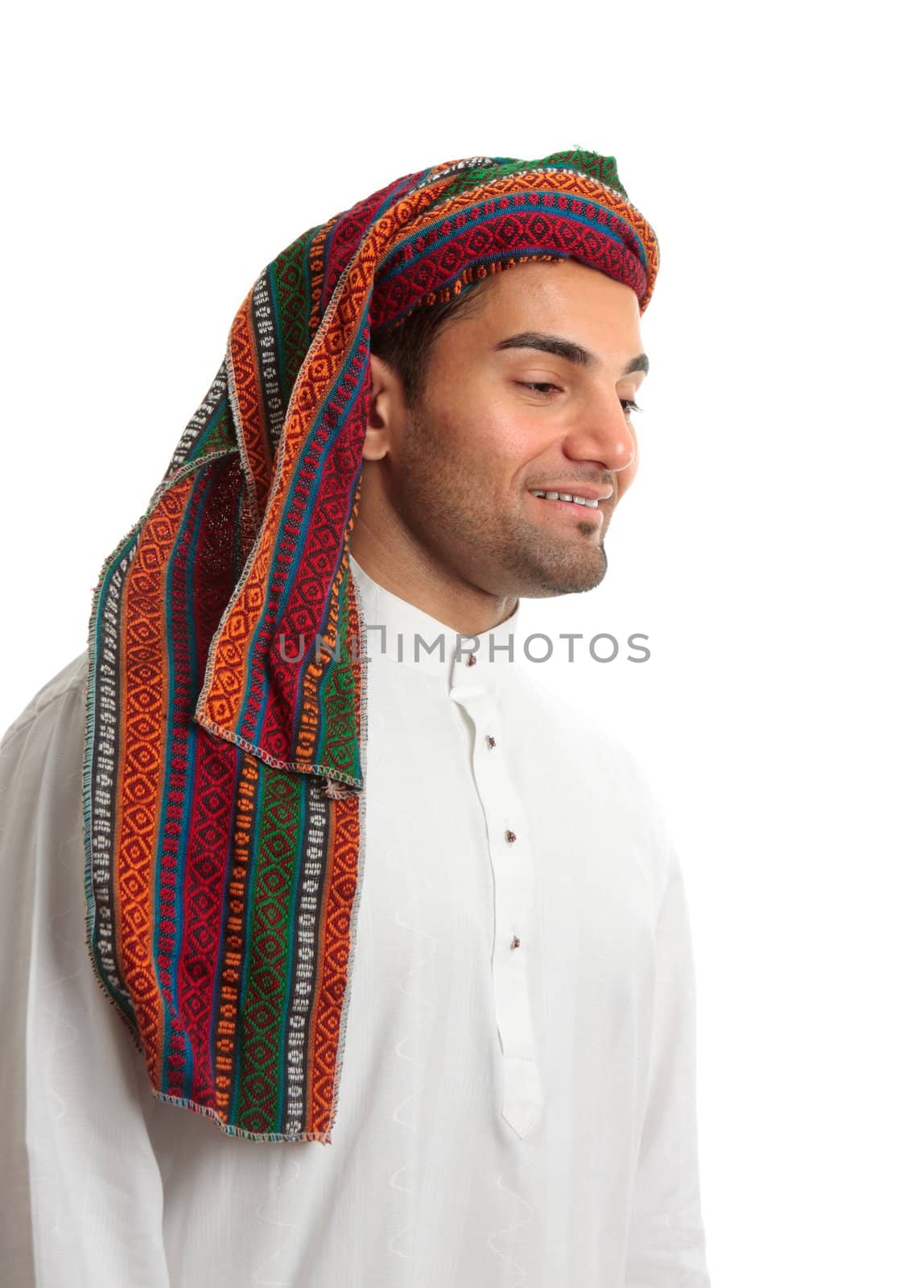 Smiling adult arab middle eastern mixed race man in traditional clothing.  He is looking down.  Suitable for a message.  White background.