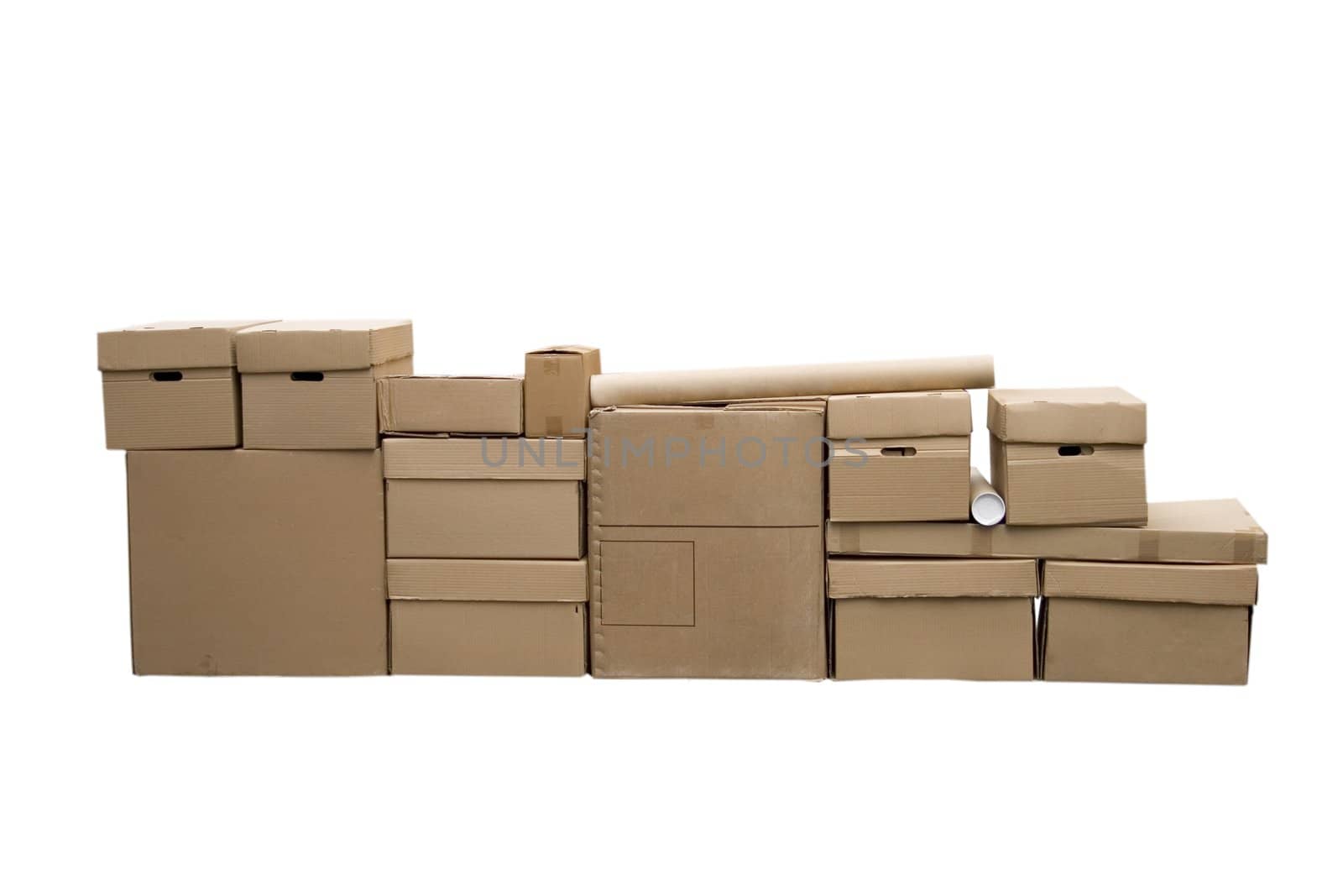 Brown different cardboard boxes arranged in stack on white background