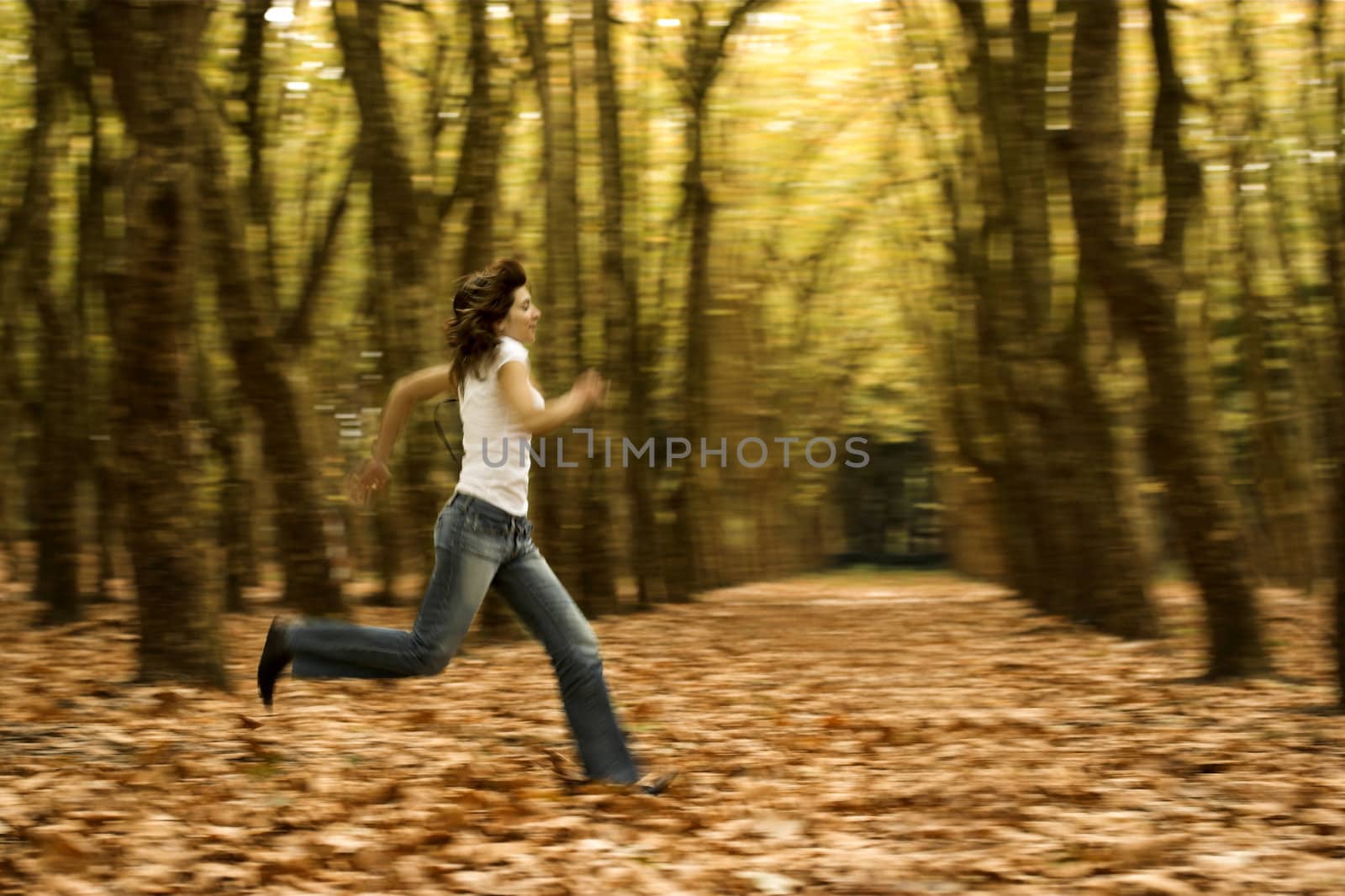 Woman runing in the Autumn Park -  Intentional blured efect