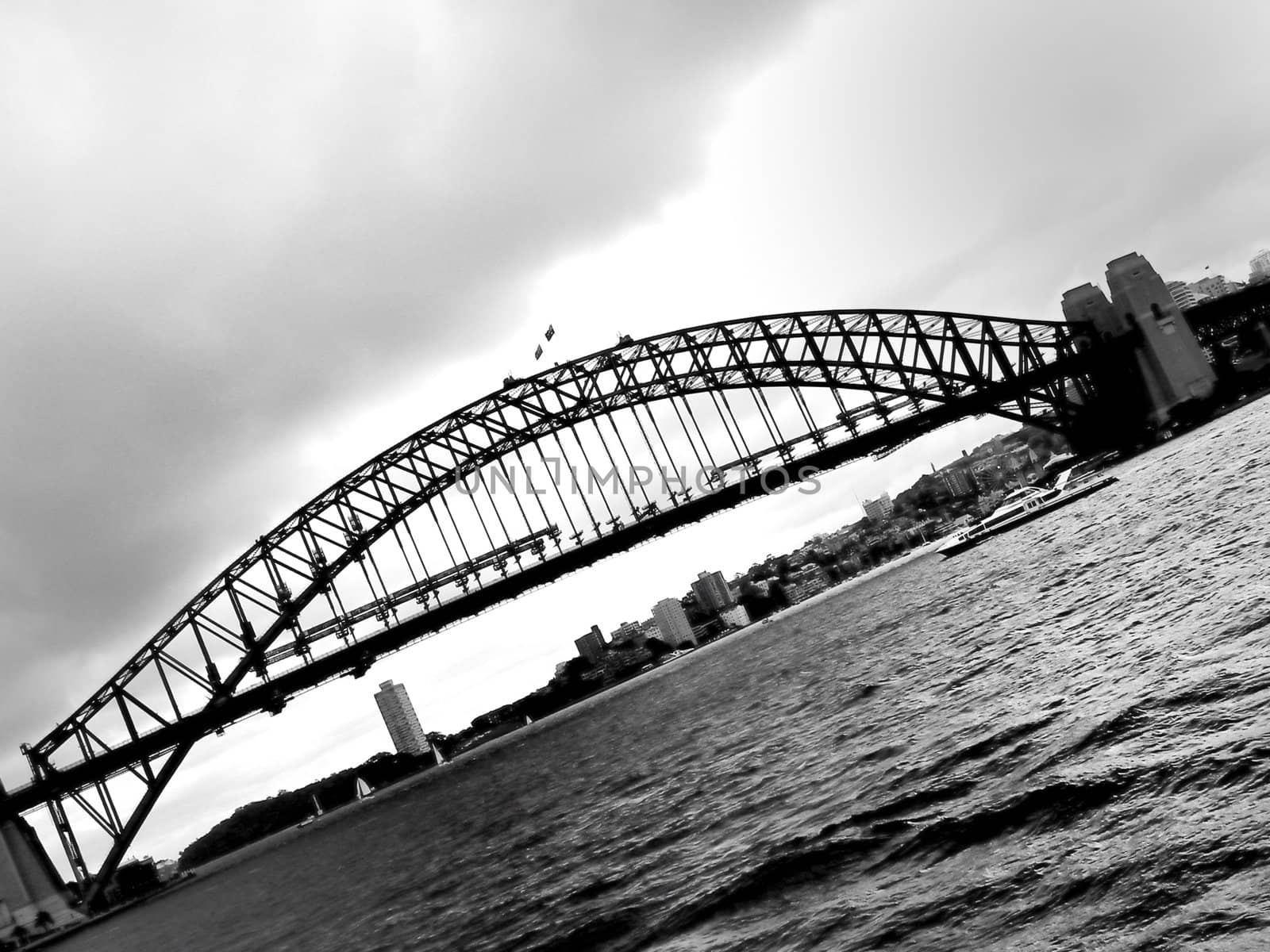 Photo presents Harbour Bridge. Photo is black and white.
