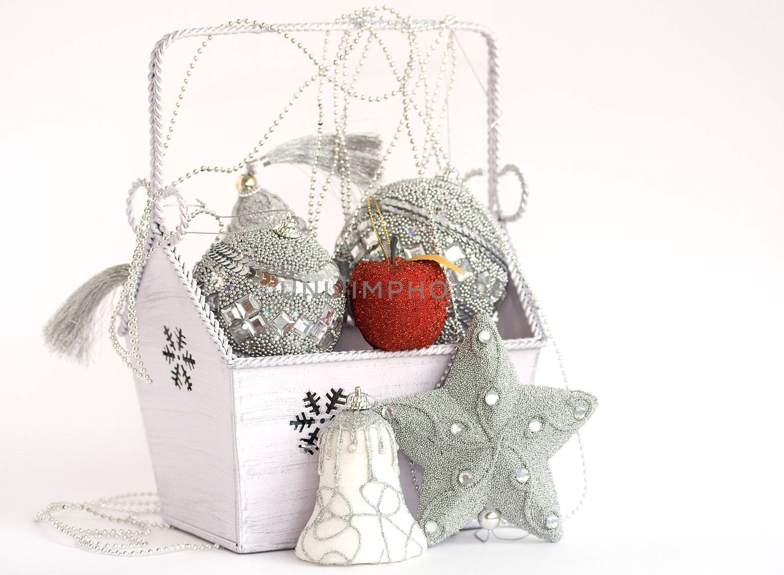 Red apple in box with silver christmas decoration by serpl