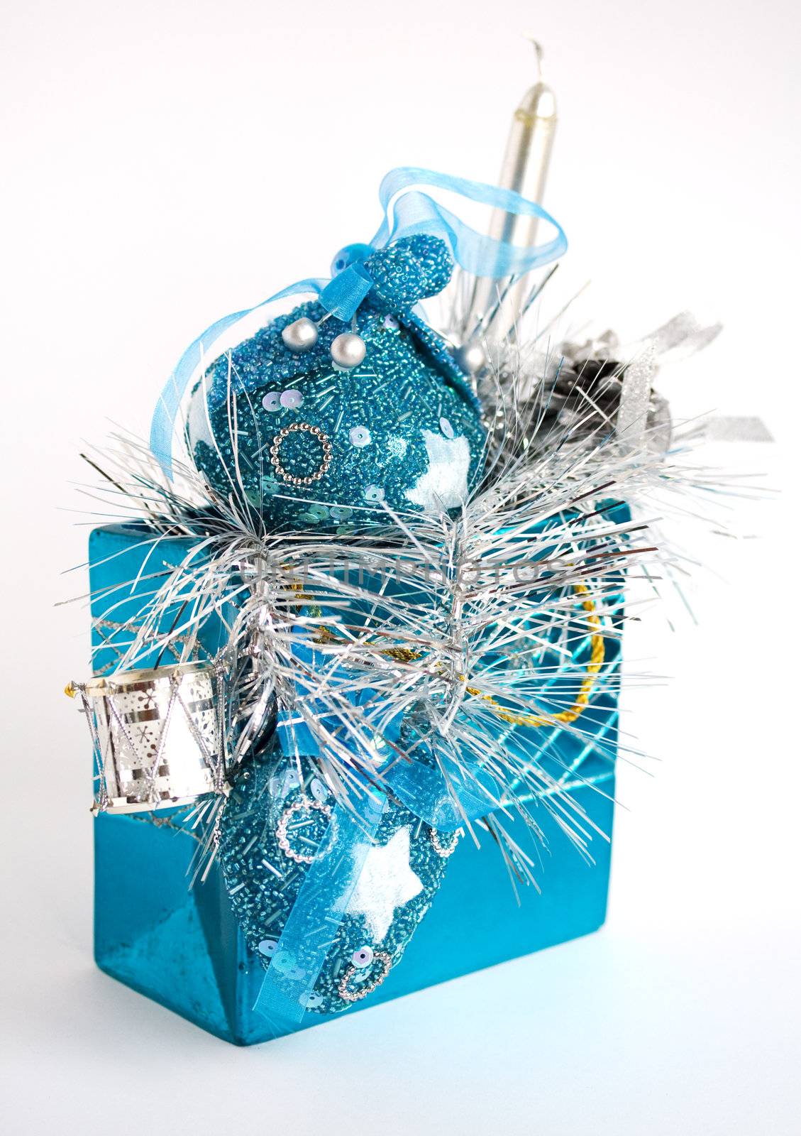 Blue bag with christmas toys on white background. Selective focus