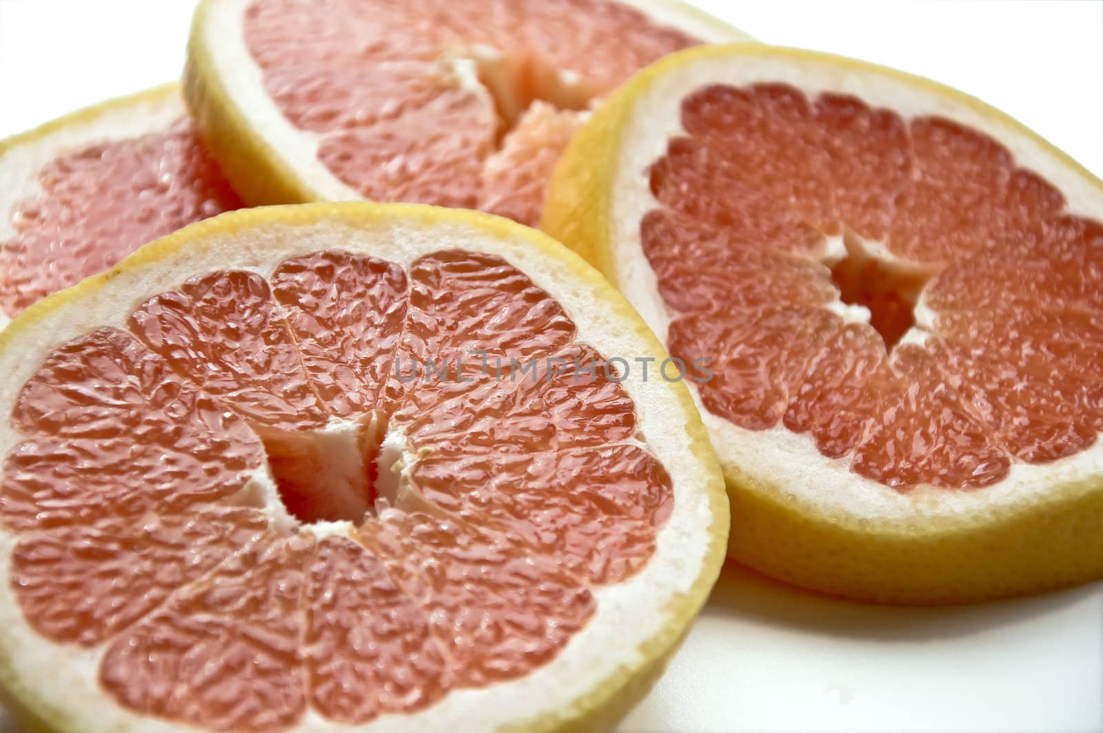 Cut slices of ripe, juicy fresh oranges. Isolation on white background.