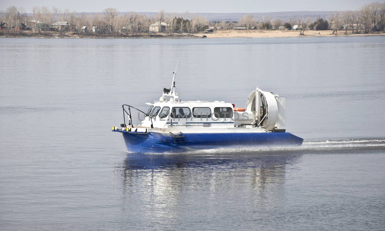 Hovercraft rides on the water by Oledjio