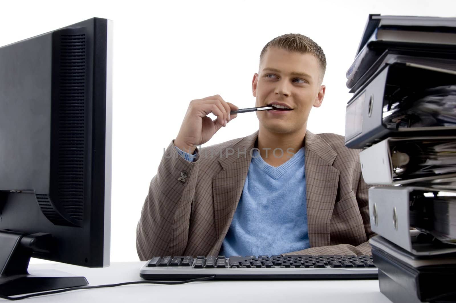 young man sitting in office by imagerymajestic