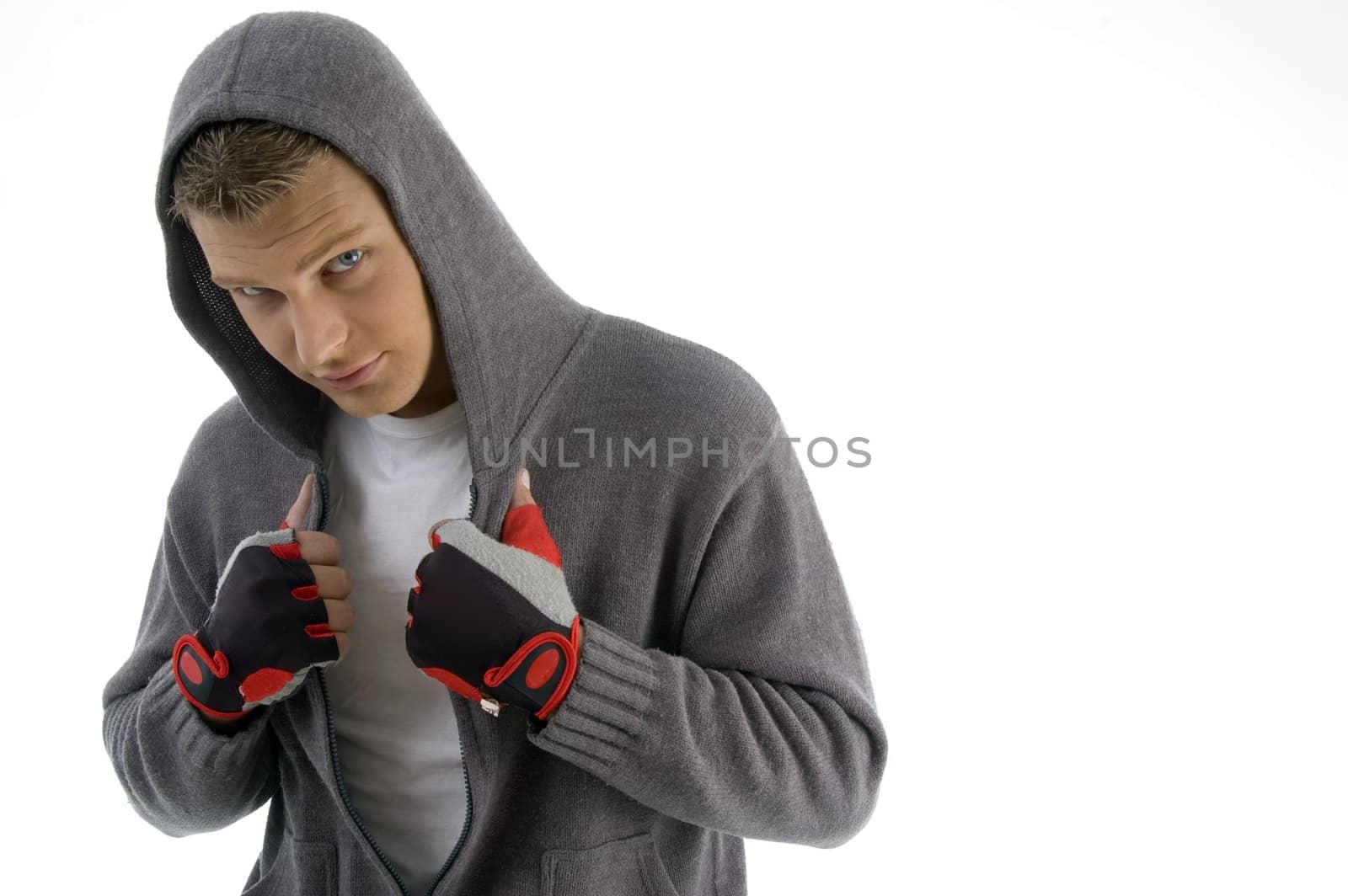 sportive man posing with hood jacket against white background