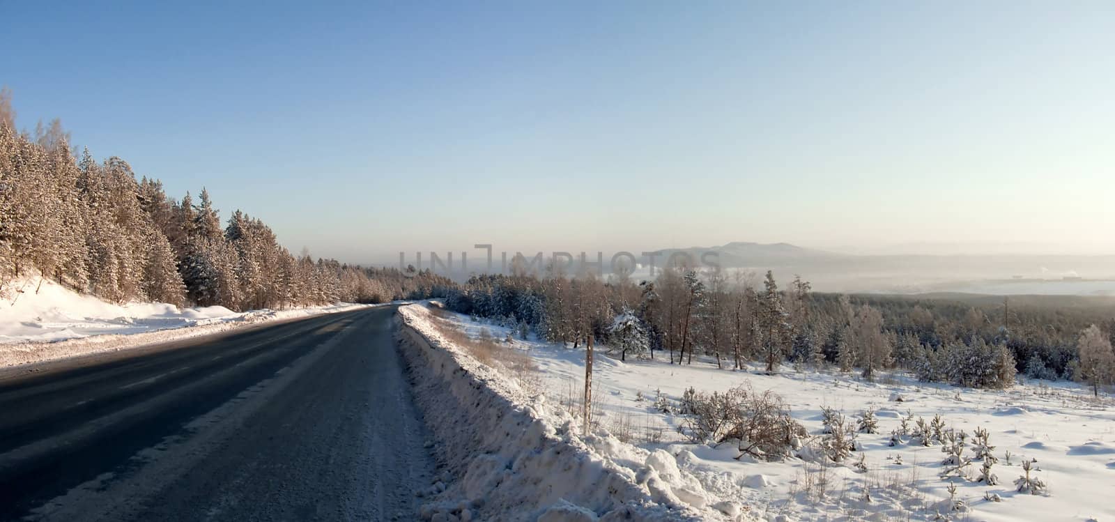 Desert ice the winter road in the mountains of the Urals. by Oledjio