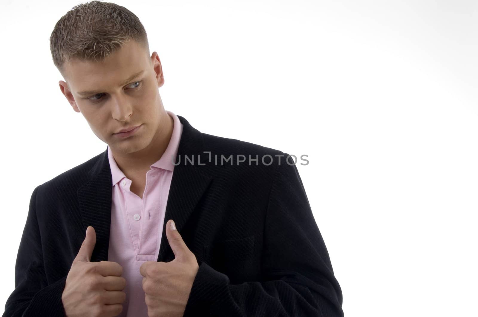 businessman holding coat and looking sideways with white background