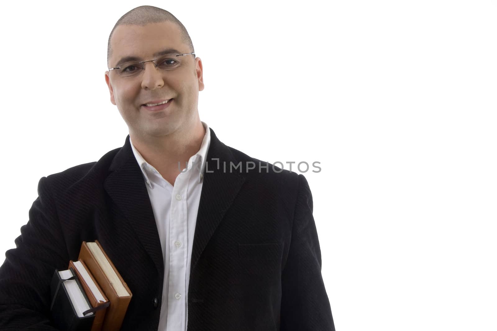 smiling businessman with books by imagerymajestic