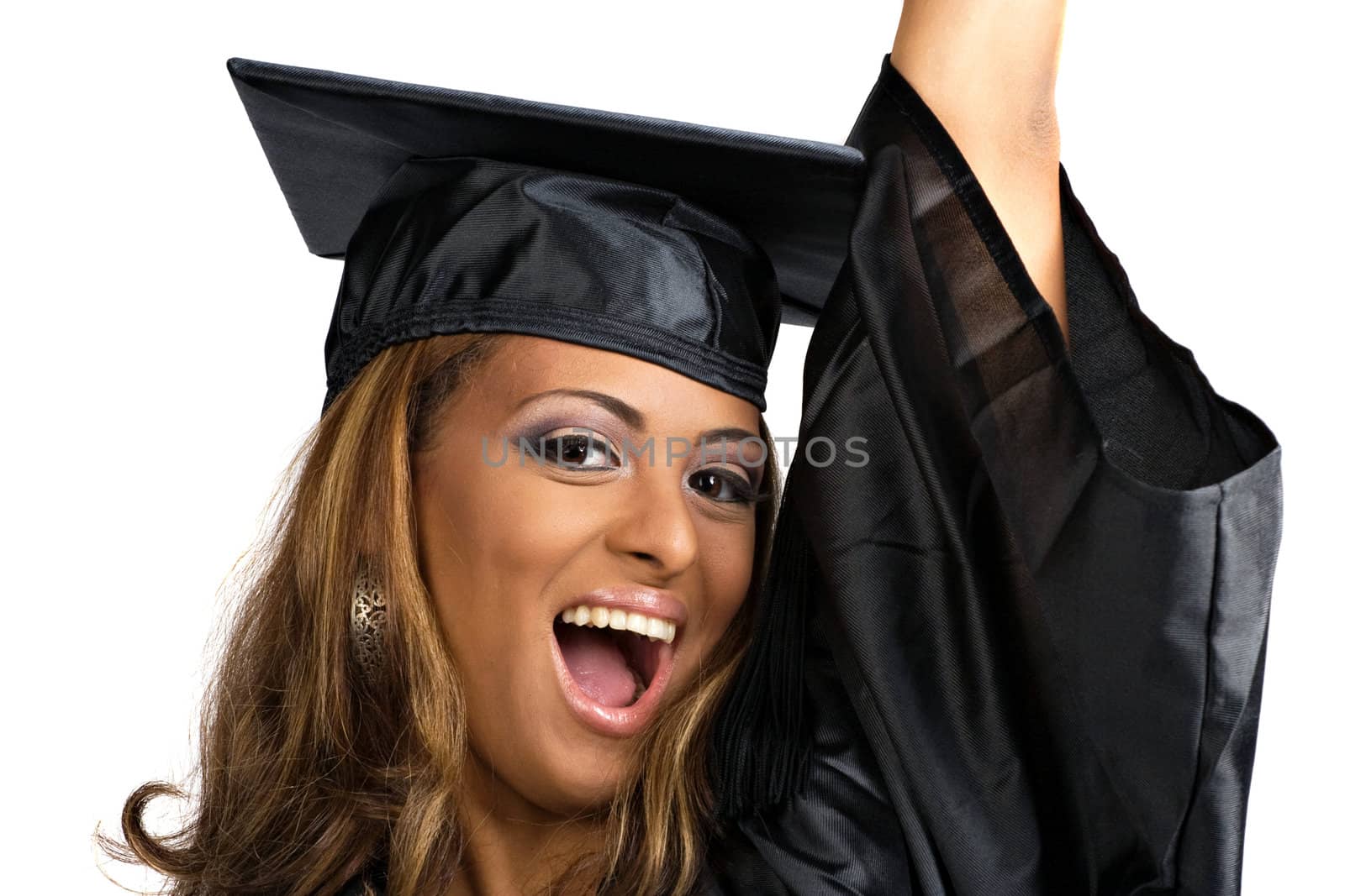 A happy graduate woman cheering happily in celebration of her recent achievement isolated over a white background.