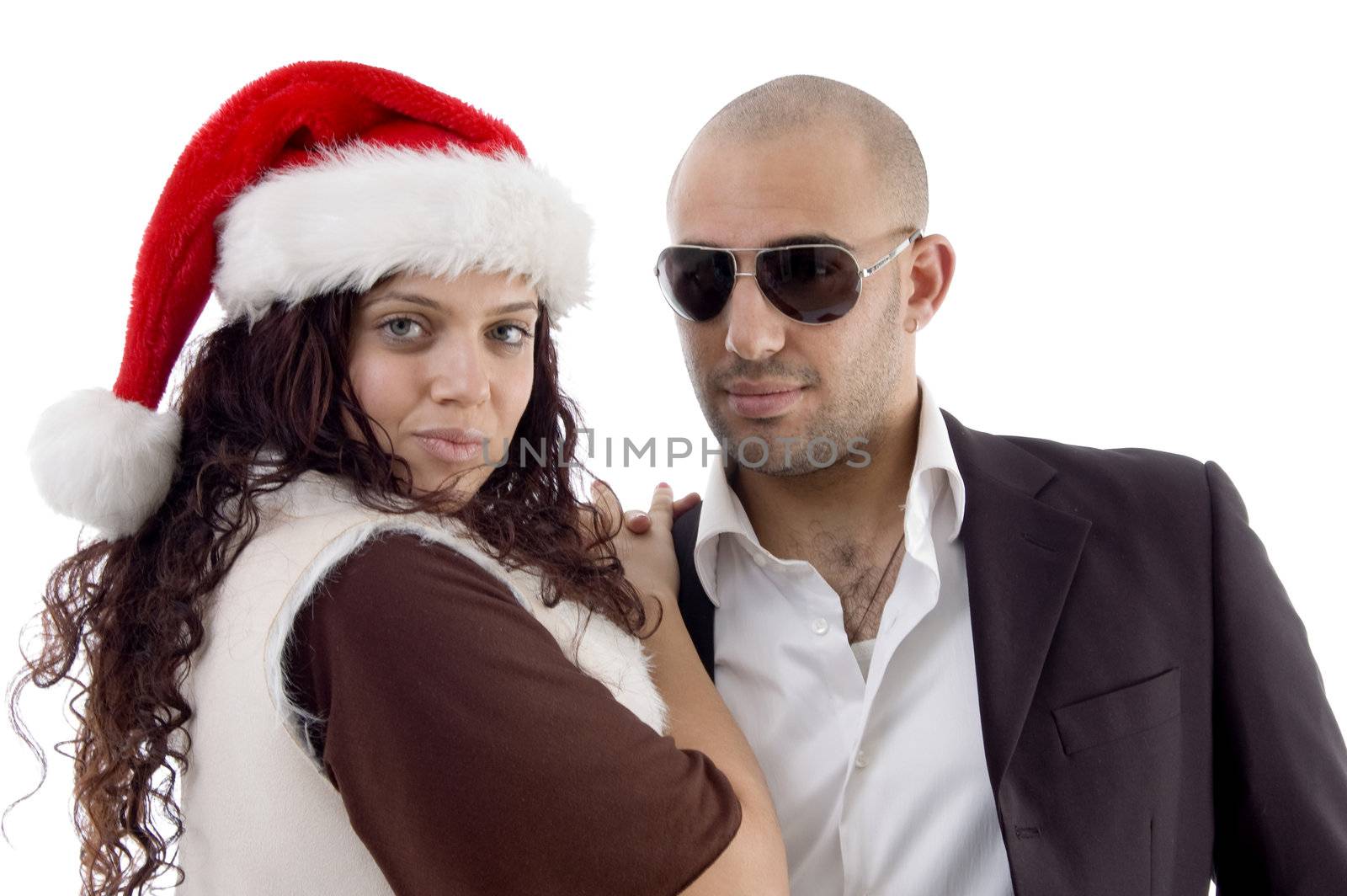 young lovers with christmas hat on an isolated background