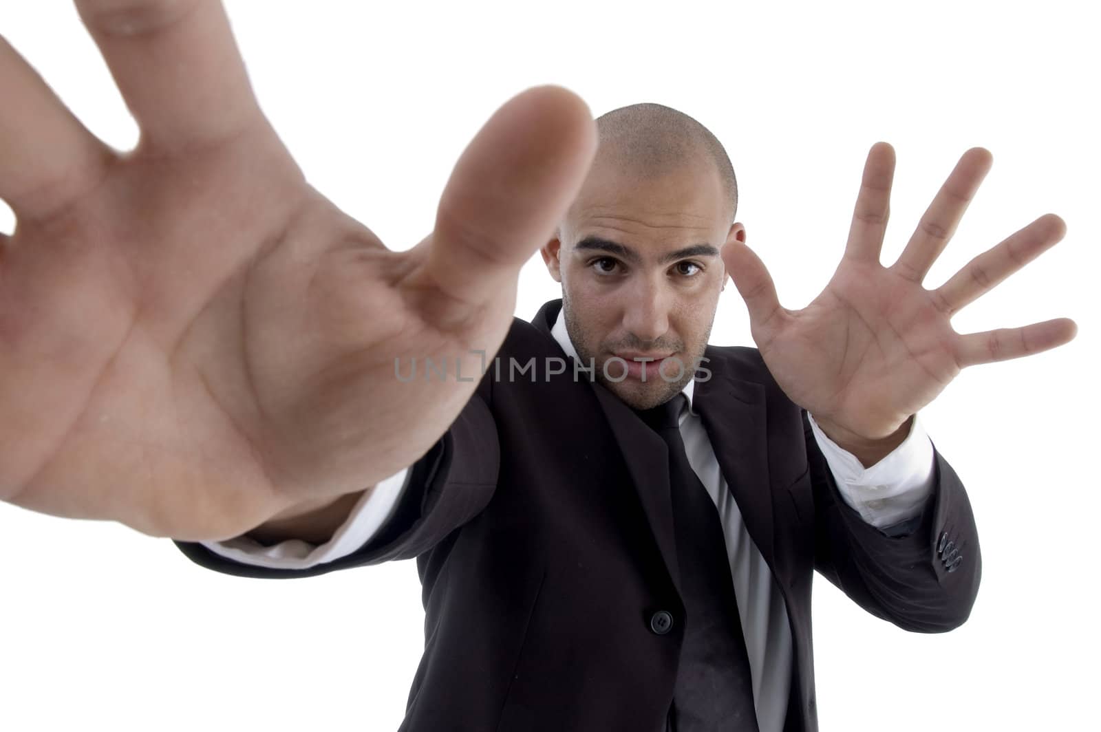 handsome young lawyer showing open palms on an isolated background