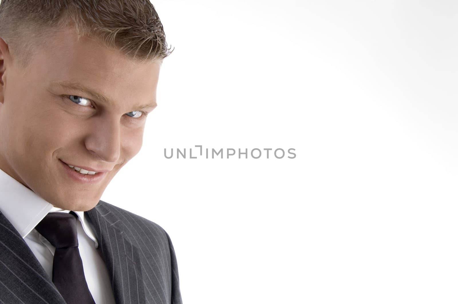 close up of handsome young man looking at camera with white background