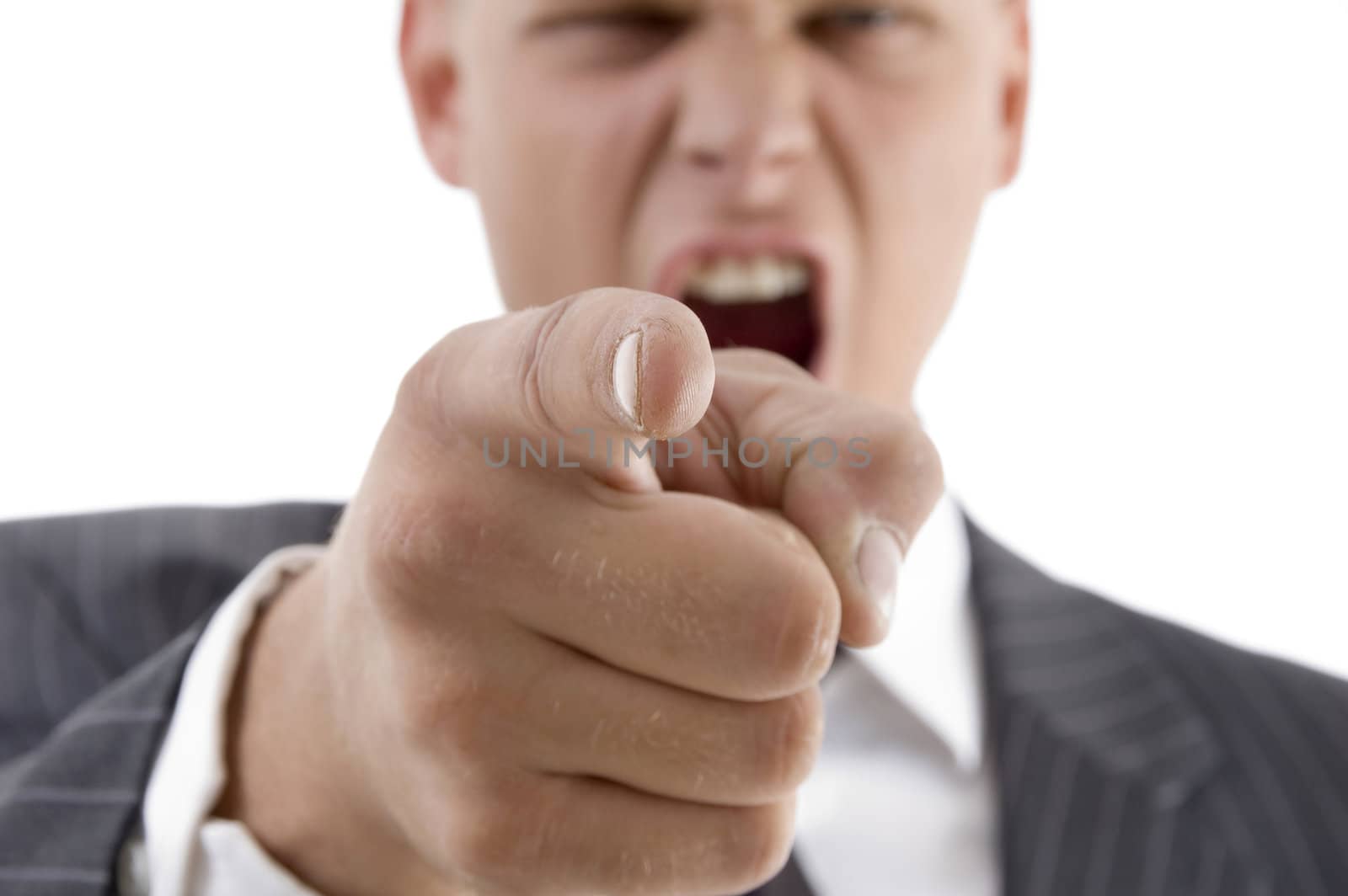 businessman indicating at camera on an isolated white background