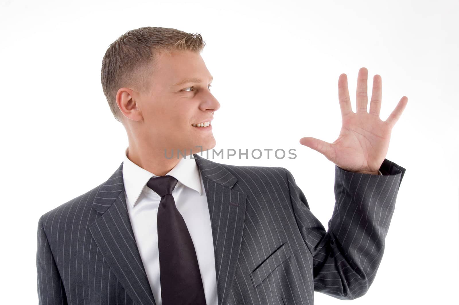 portrait of businessman counting fingers against white background