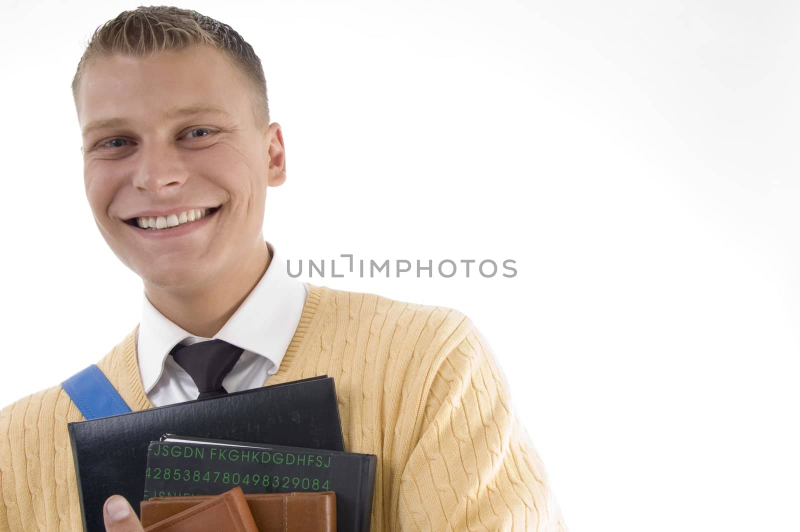 casual teenager preparing to school and smiling against white background