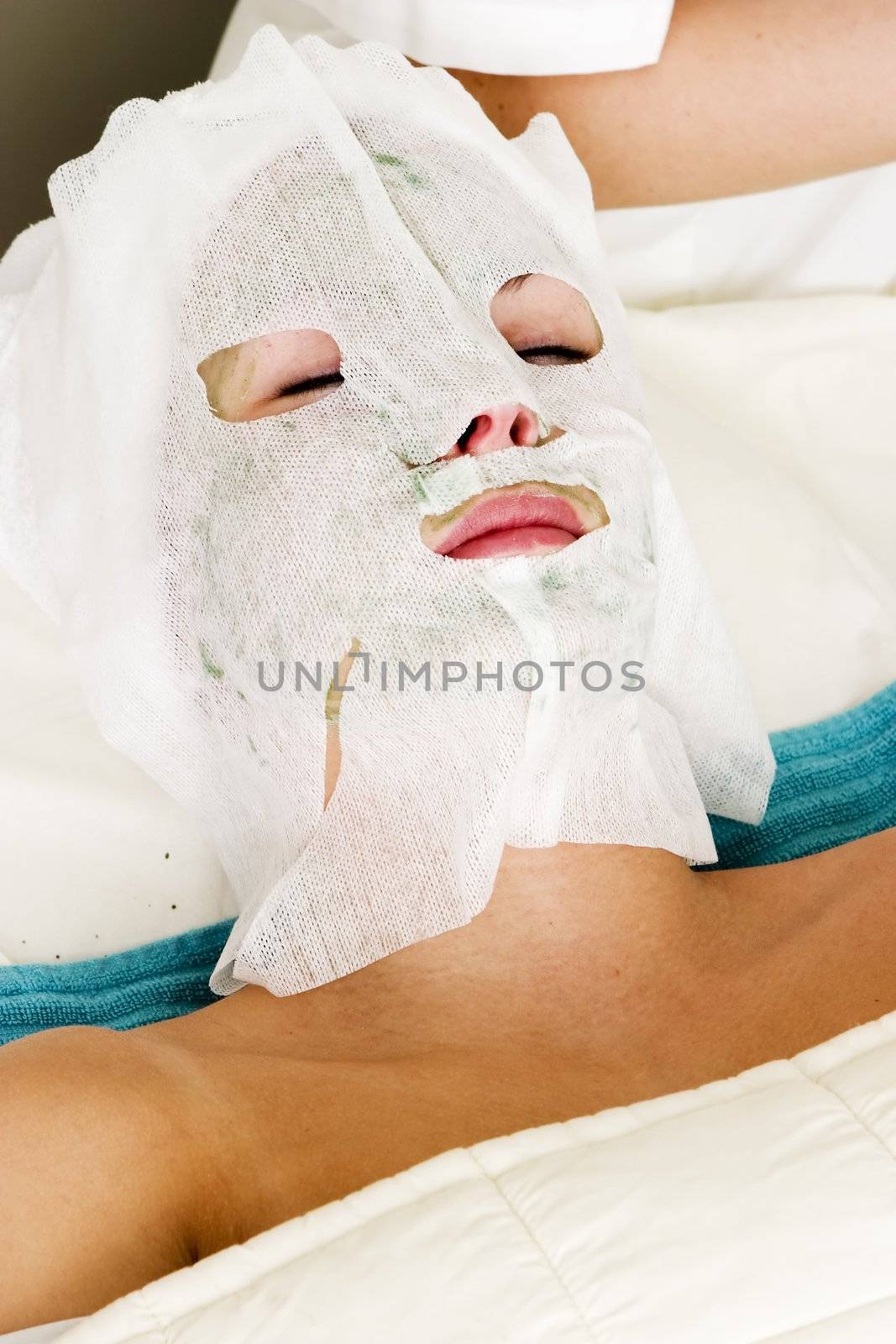 A detail image of a facial mask being applied at a beauty spa.