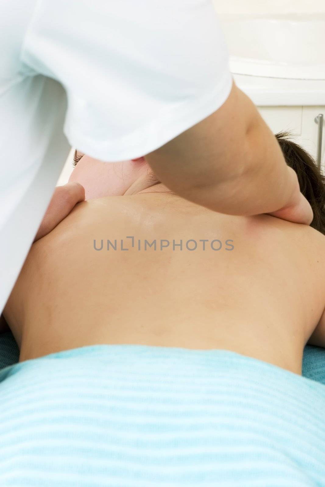 Back massage detail at a day spa.