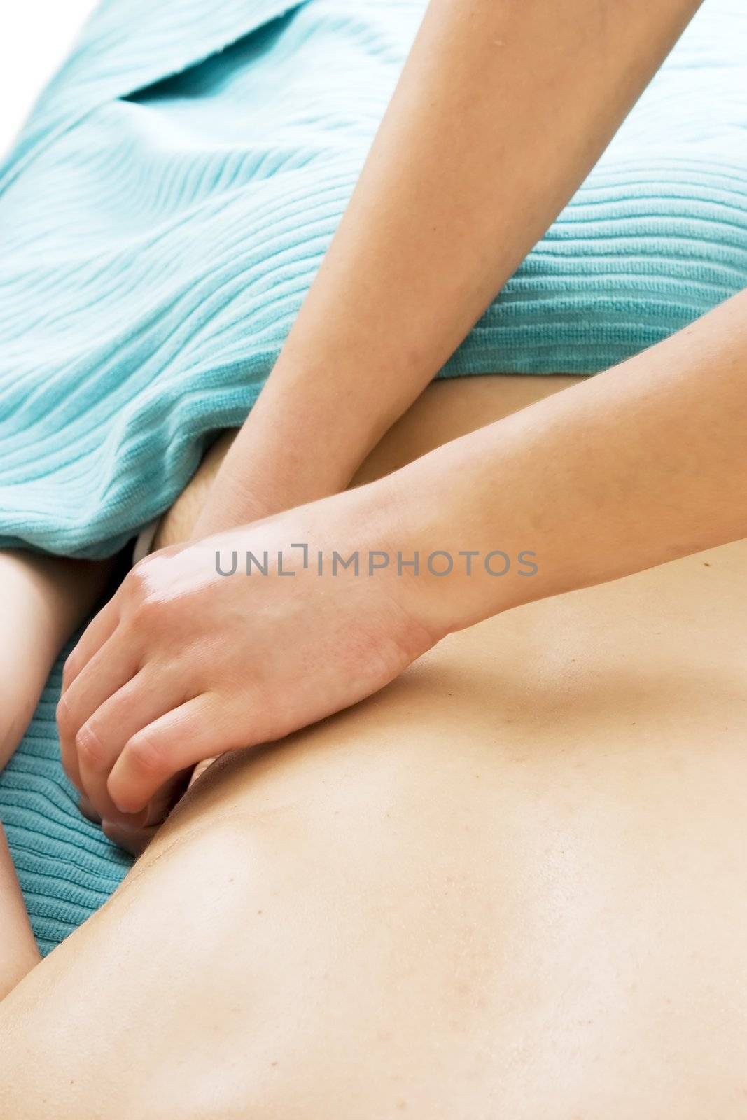 A detail image of a female receiving a back massage at a day spa.