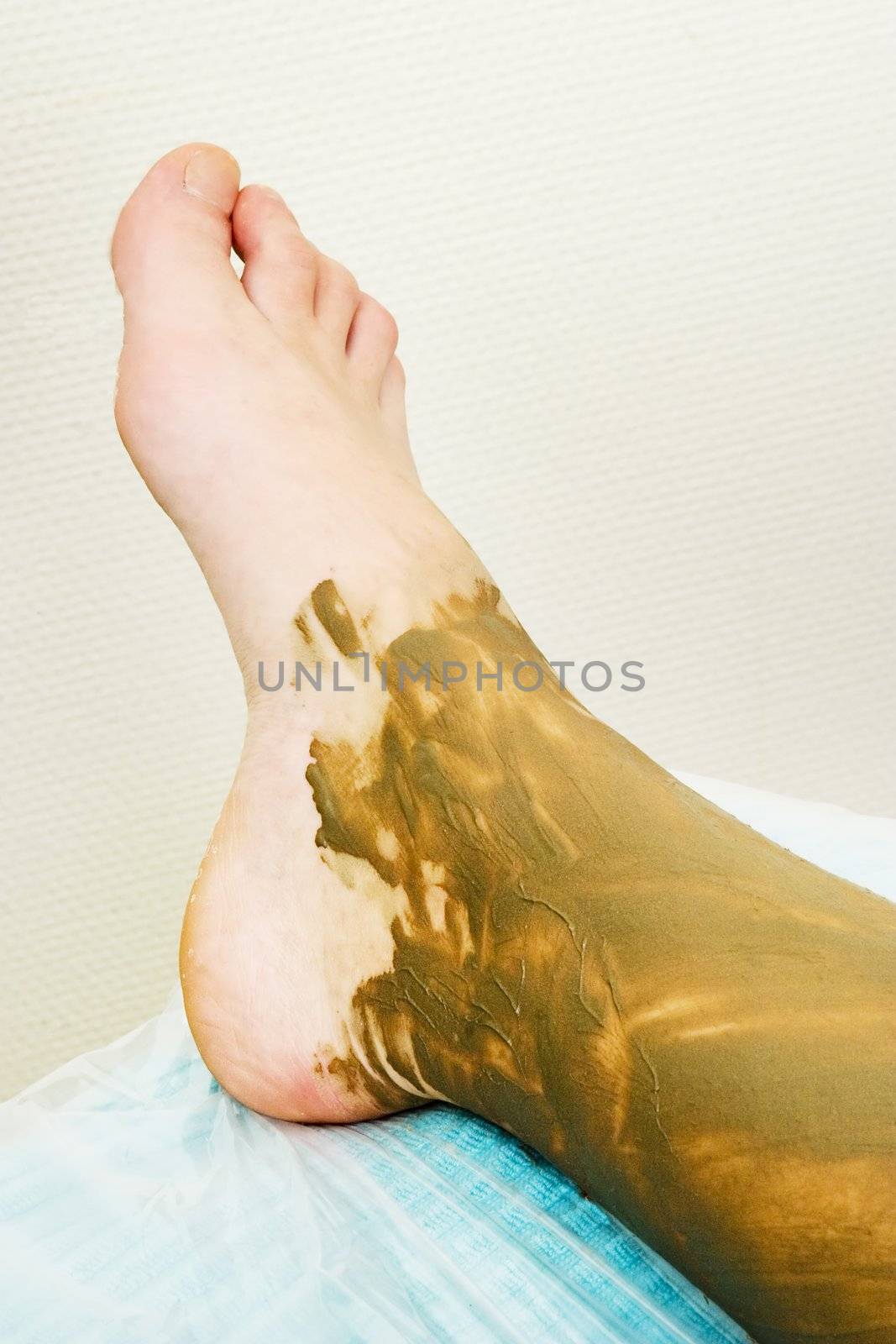 A detail image of a sea mud full body wrap at a luxury spa.