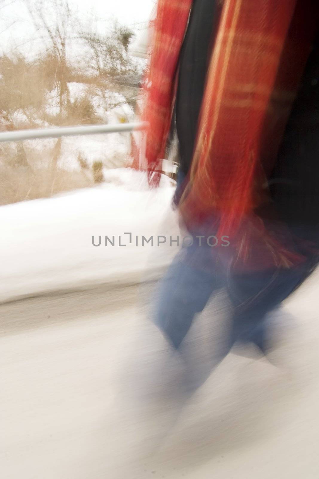 A motion blur abstract of a person walking in a hurry, a late rushing concept image.