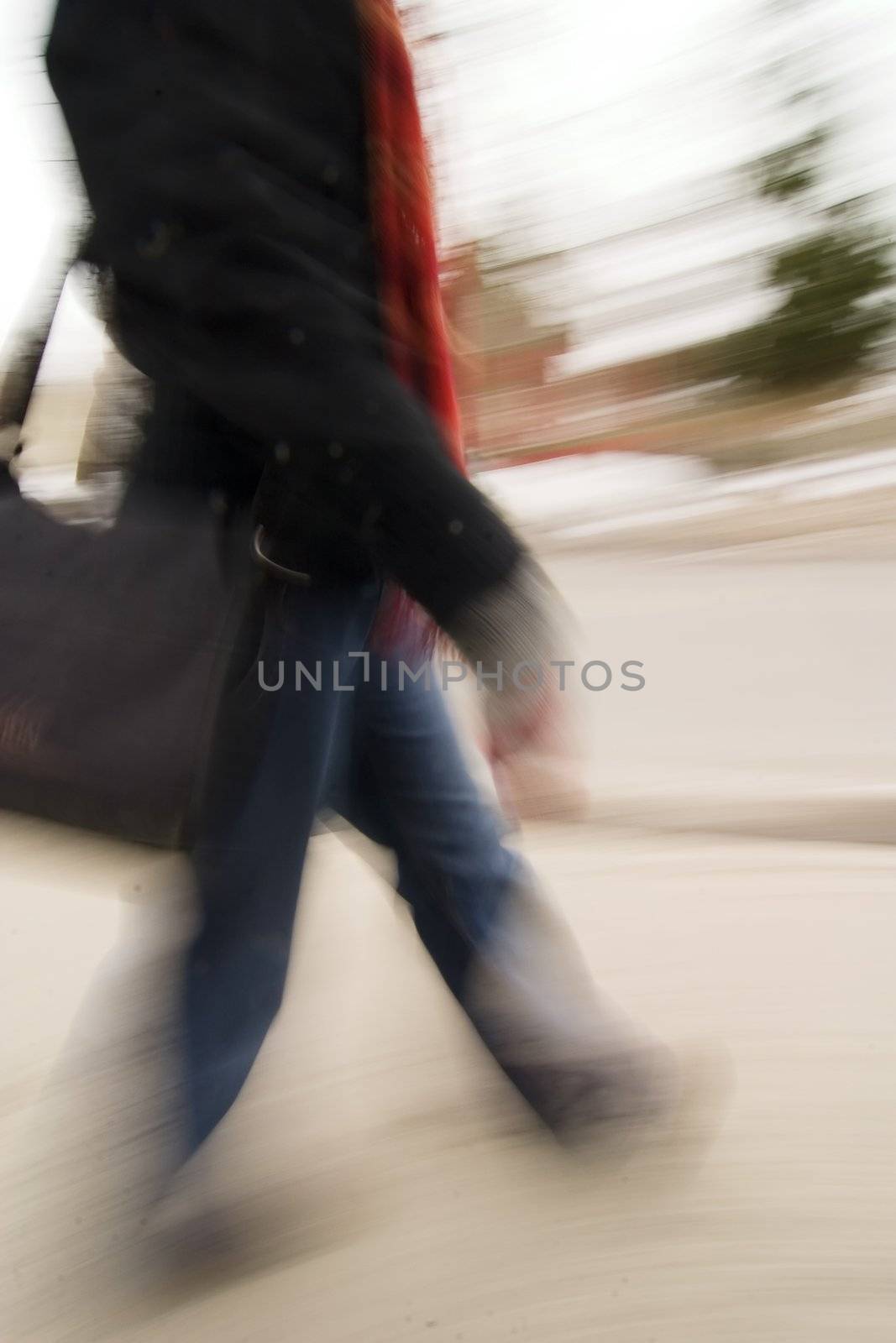A motion blur abstract of a person walking in a hurry, a late rushing concept image.