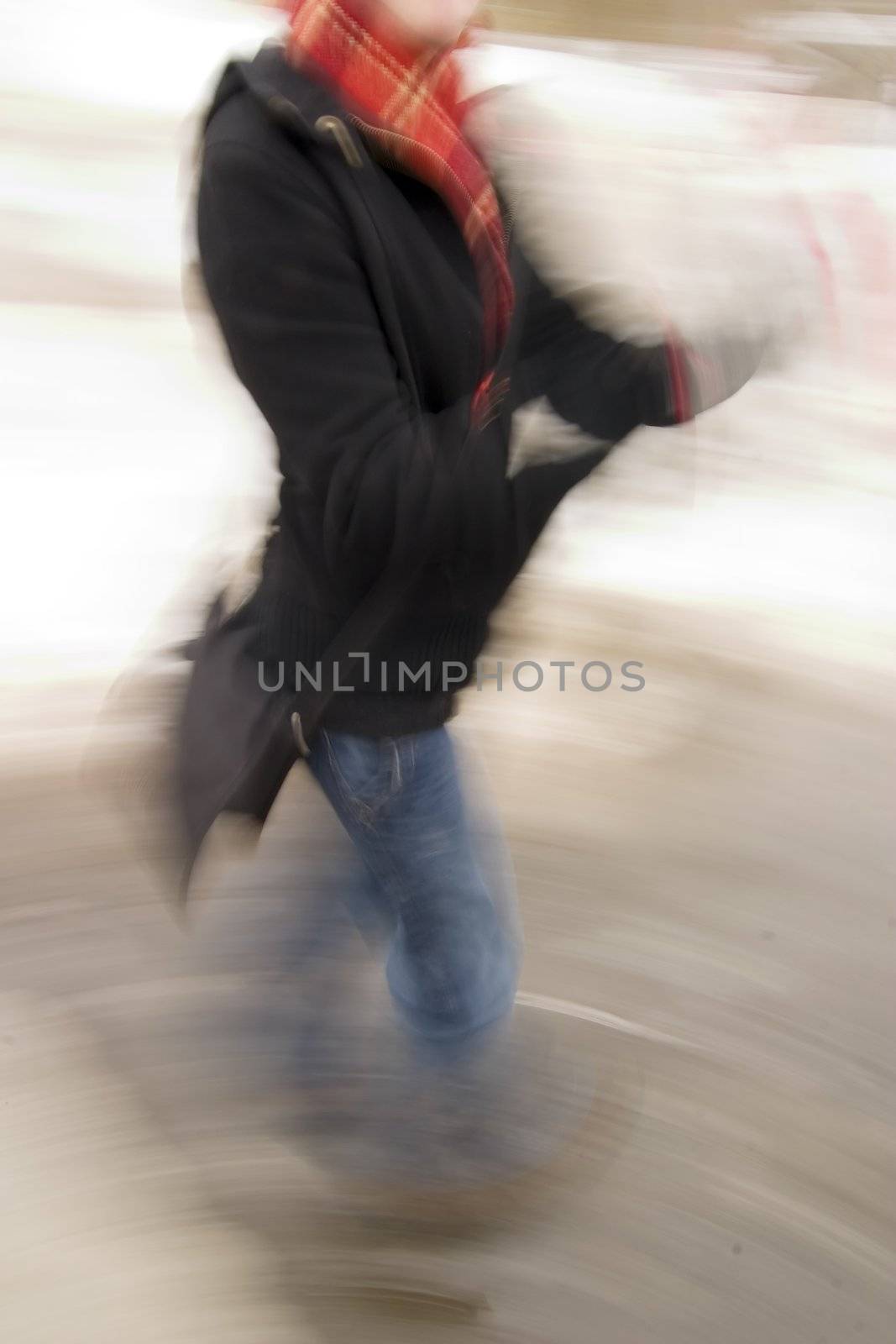 A motion blur abstract of a person walking in a hurry, a late rushing concept image.