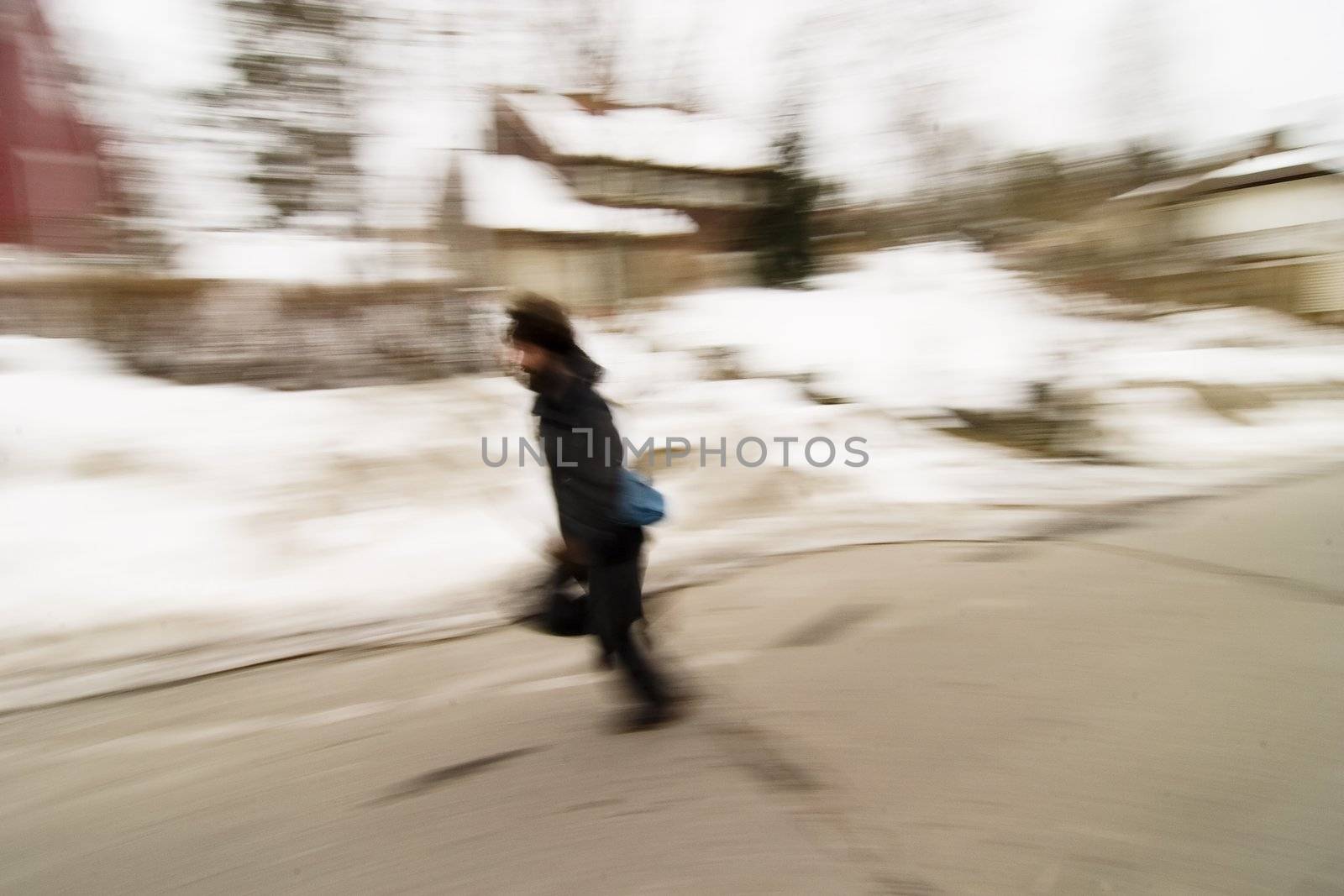 A motion blur image of a man running.